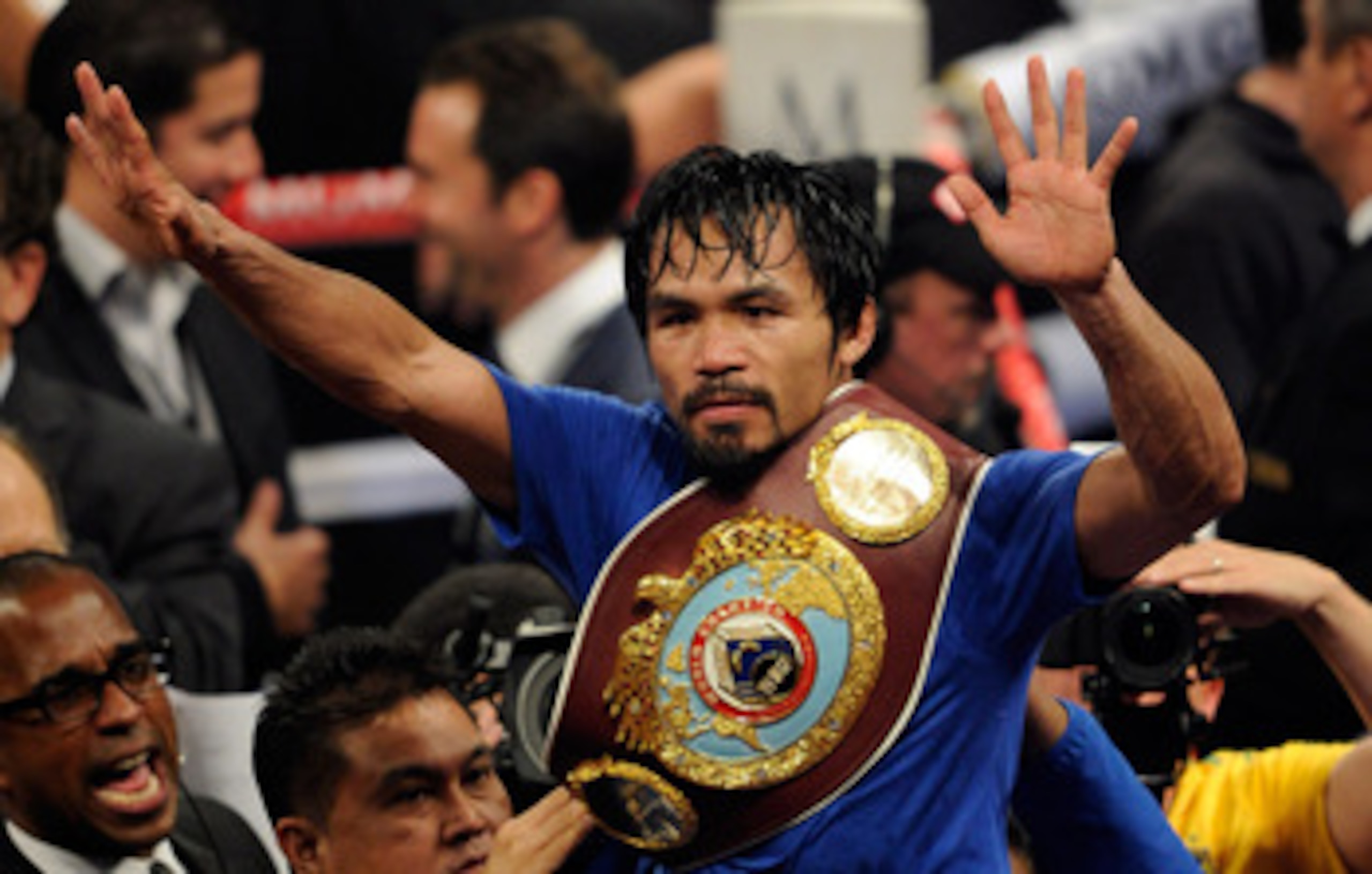 LAS VEGAS, NV - MAY 07:  Manny Pacquiao of the Philippines celebrates after his unanimous decision victory against Shane Mosley in the WBO welterweight title fight at MGM Grand Garden Arena on May 7, 2011 in Las Vegas, Nevada.  (Photo by Ethan Miller/Gett