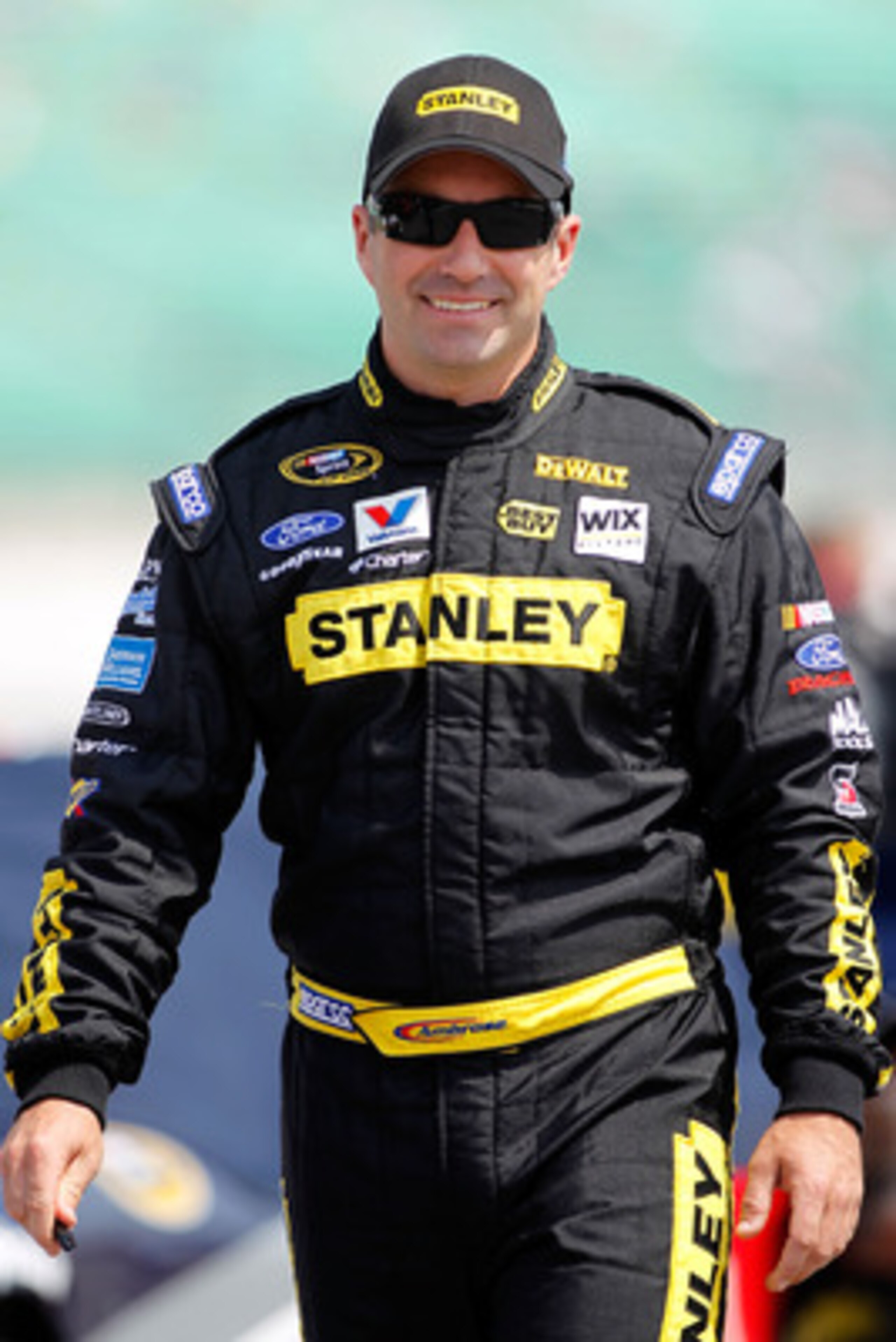 KANSAS CITY, KS - JUNE 04: Marcos Ambrose, driver of the #9 Stanley Ford, stands on the grid during qualifying for the NASCAR Sprint Cup Series STP 400 at Kansas Speedway on June 4, 2011 in Kansas City, Kansas. (Photo by Todd Warshaw/Getty Images) KANSAS CITY, KS - JUNE 04: Marcos Ambrose, driver of the #9 Stanley Ford, stands on the grid during qualifying for the NASCAR Sprint Cup Series STP 400 at Kansas Speedway on June 4, 2011 in Kansas City, Kansas. (Photo by Todd Warshaw/Getty Images)