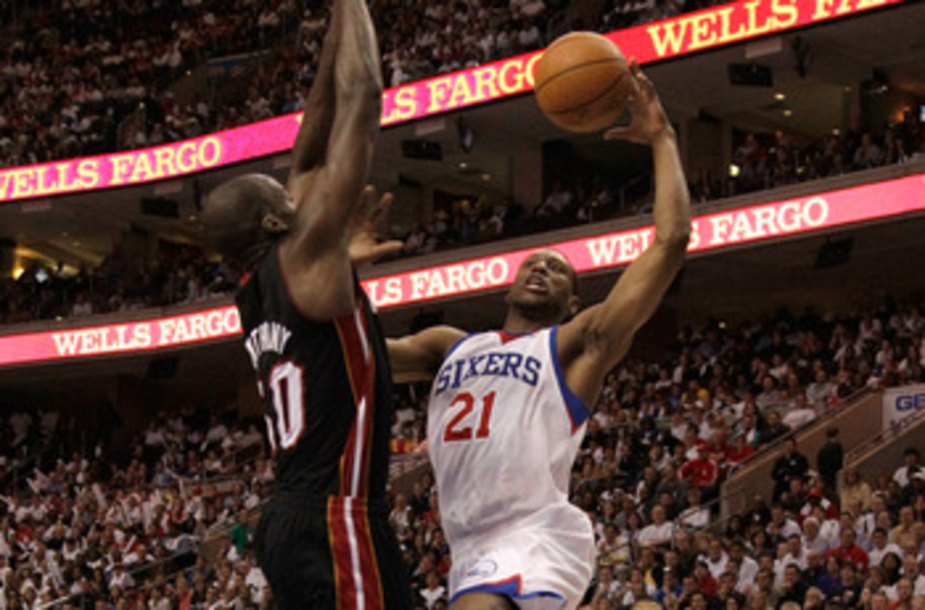 PHILADELPHIA, PA - APRIL 21: Joel Anthony #50 of the Miami Heat defends a Thaddeus Young #21 of the Philadelphia 76ers puts up a shot in Game Three of the Eastern Conference Quarterfinals during the 2011 NBA Playoffs at Wells Fargo Center on April 21, 201