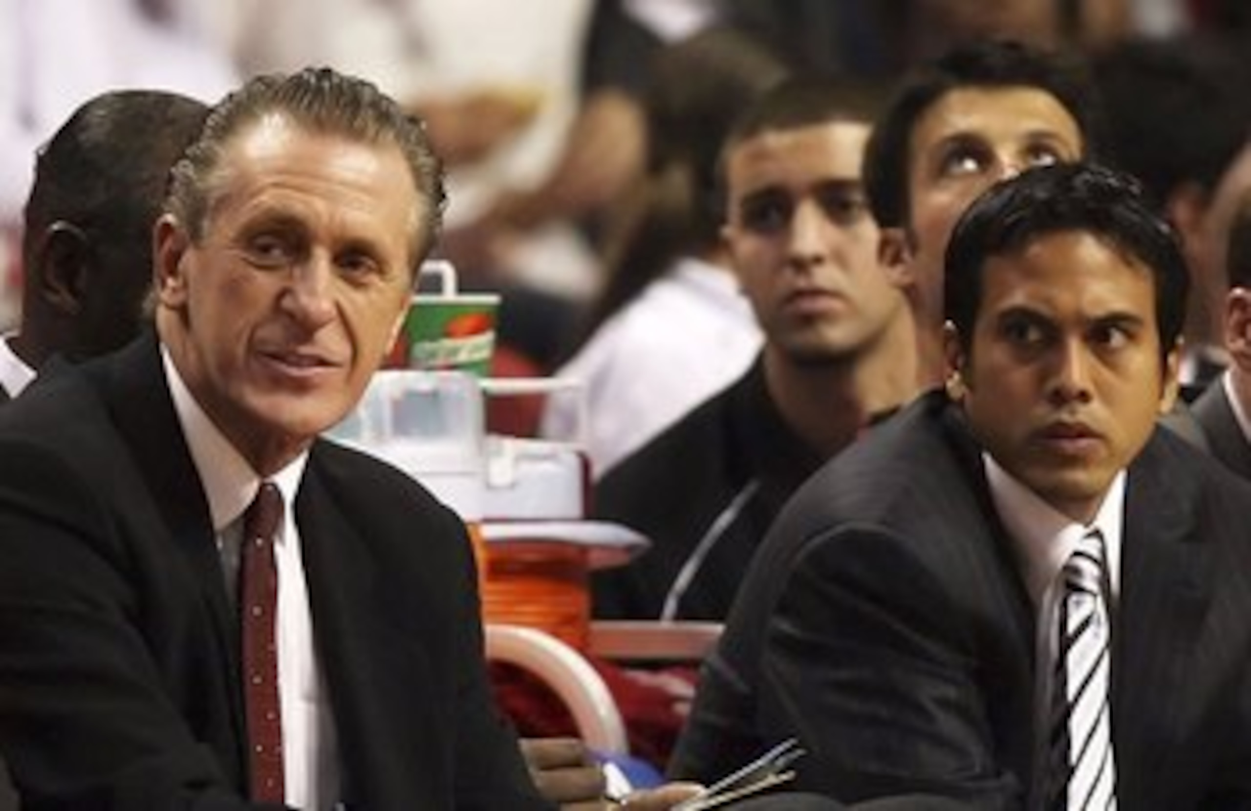 MIAMI - OCTOBER 31: (L-R) Wearing his new NBA Championship ring, head coach Pat Riley, assistant coach Erik Spoelstra and injured player Jason Williams #55 of the Miami Heat watch from the bench in the second half against the Chicago Bulls on opening nig MIAMI - OCTOBER 31: (L-R) Wearing his new NBA Championship ring, head coach Pat Riley, assistant coach Erik Spoelstra and injured player Jason Williams #55 of the Miami Heat watch from the bench in the second half against the Chicago Bulls on opening nig