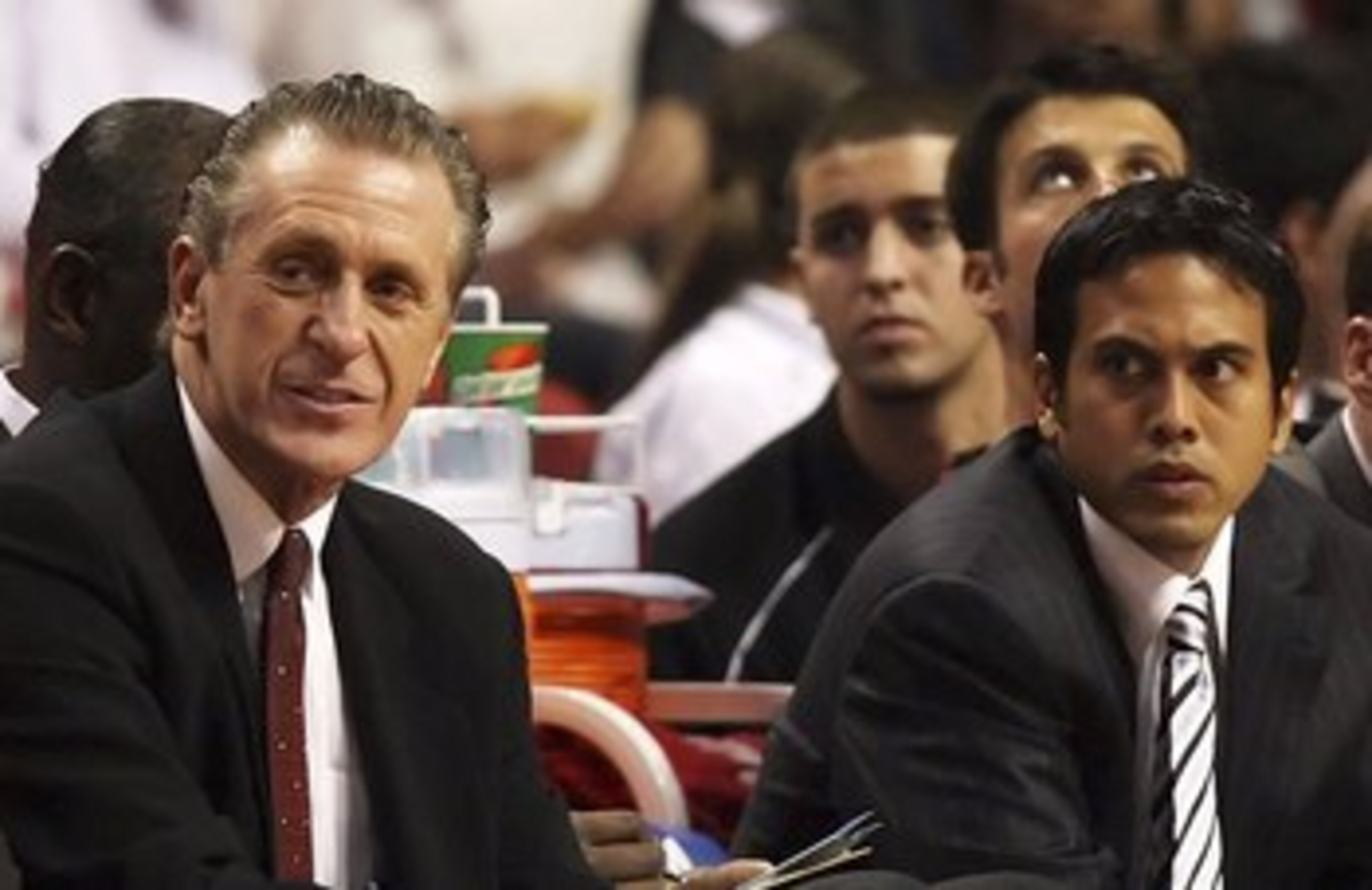 MIAMI - OCTOBER 31: (L-R) Wearing his new NBA Championship ring, head coach Pat Riley, assistant coach Erik Spoelstra and injured player Jason Williams #55 of the Miami Heat watch from the bench in the second half against the Chicago Bulls on opening nig MIAMI - OCTOBER 31: (L-R) Wearing his new NBA Championship ring, head coach Pat Riley, assistant coach Erik Spoelstra and injured player Jason Williams #55 of the Miami Heat watch from the bench in the second half against the Chicago Bulls on opening nig