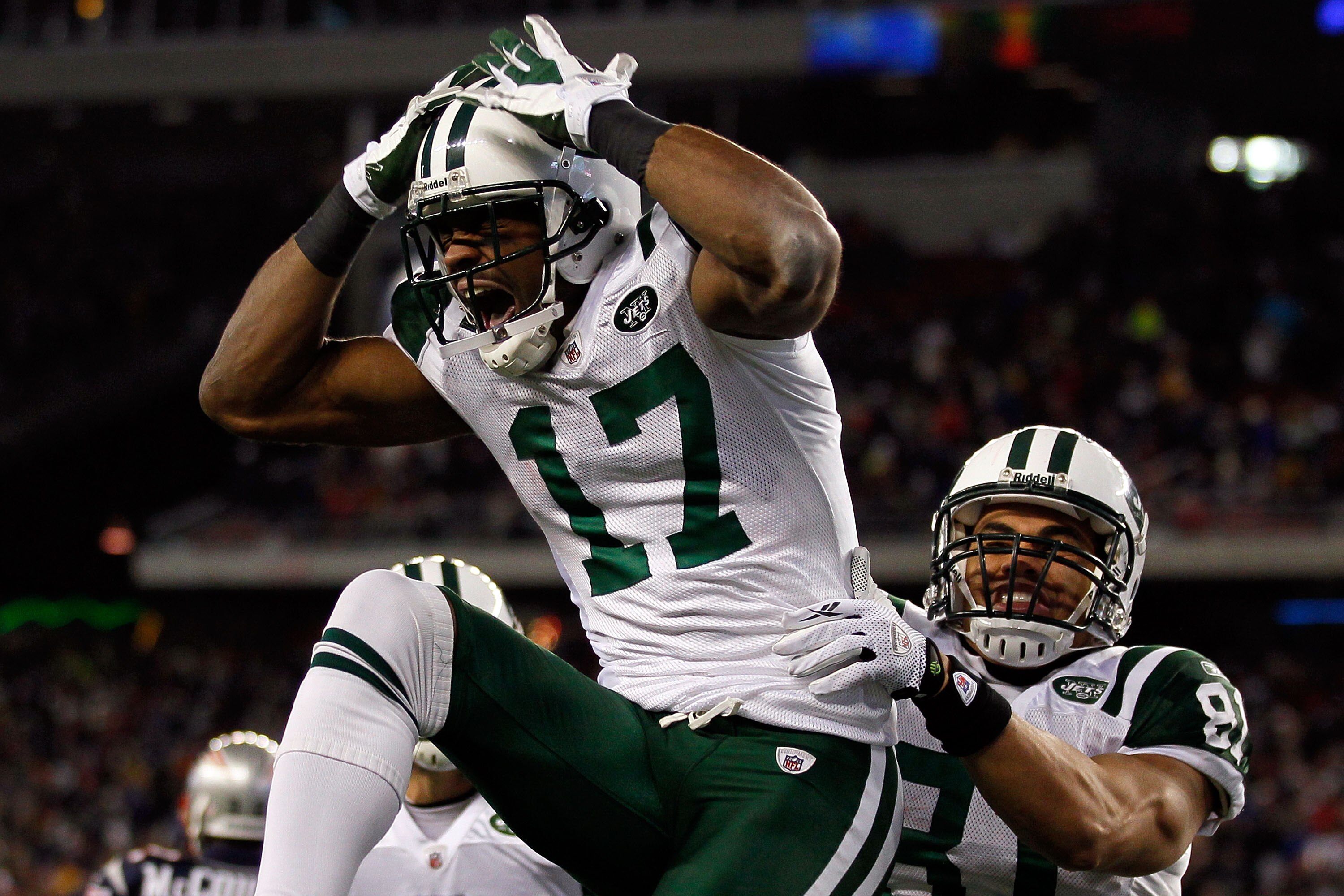 FOXBORO, MA - JANUARY 16:  Braylon Edwards #17 celebrates with Dustin Keller #81 of the New York Jets after Edwards scored a second quarter touchdown during their 2011 AFC divisional playoff game against the New England Patriots at Gillette Stadium on Jan