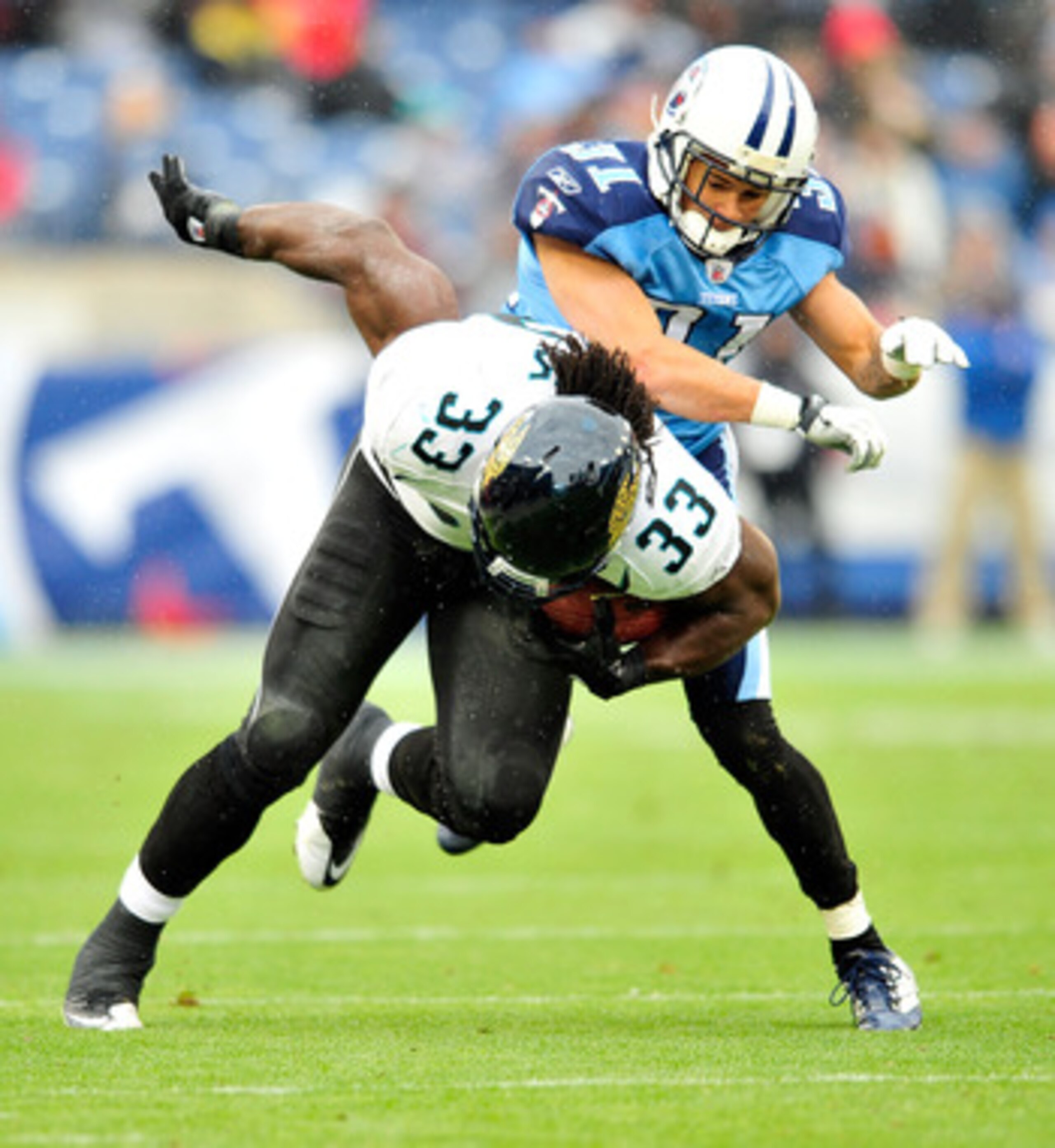 NASHVILLE, TN - DECEMBER 05:  Courtland Finnegan #31 of the Tennessee Titans tackles Maurice Jones-Drew #32 of the Jacksonville Jaguars during the first half at LP Field on December 5, 2010 in Nashville, Tennessee.  (Photo by Grant Halverson/Getty Images)