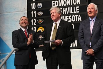 MONTREAL - JUNE 26:  NHL Commissioner Gary Bettman, Toronto Maple Leafs President & GM Brian Burke and Special Advisor Cliff Fletcher look on during the first round of the 2009 NHL Entry Draft at the Bell Centre on June 26, 2009 in Montreal, Quebec, Canad