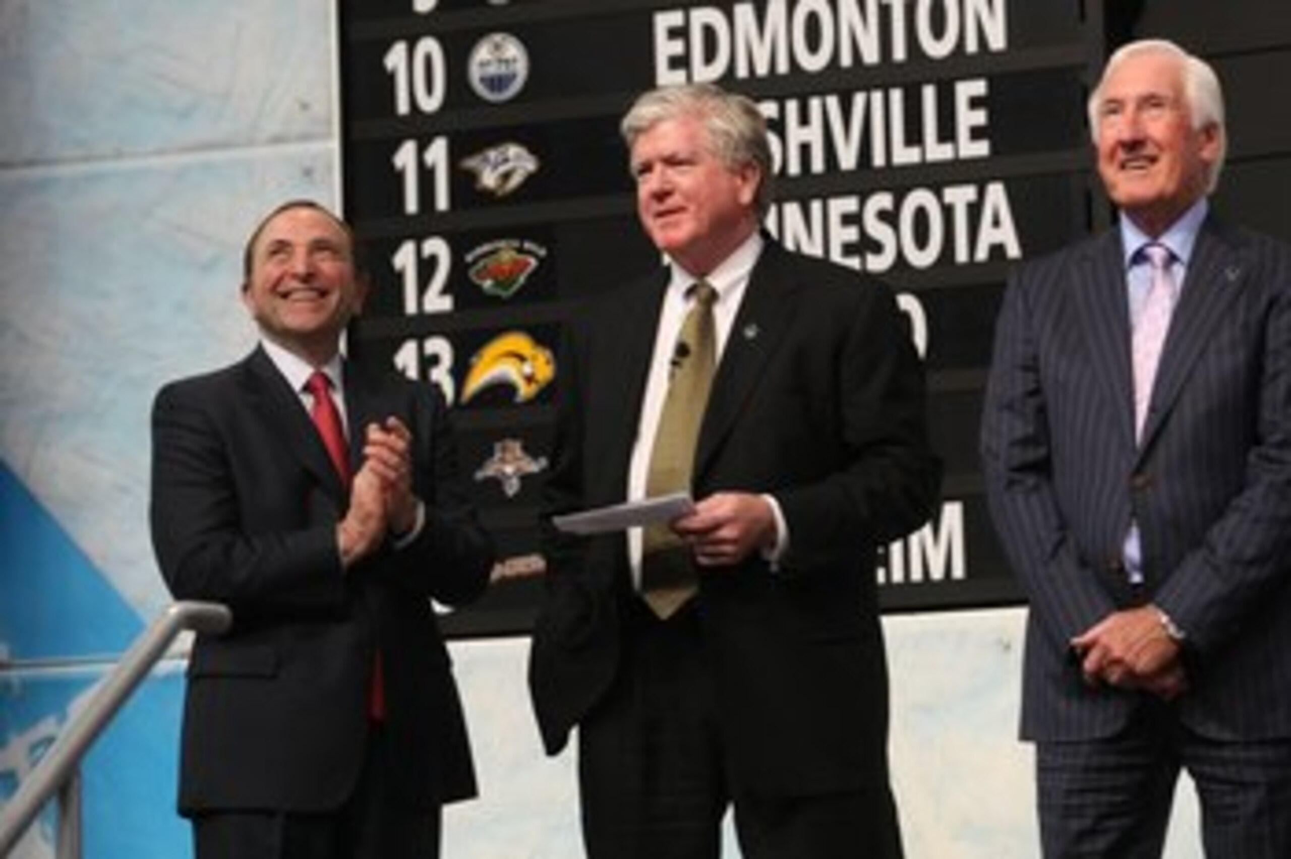 MONTREAL - JUNE 26:  NHL Commissioner Gary Bettman, Toronto Maple Leafs President & GM Brian Burke and Special Advisor Cliff Fletcher look on during the first round of the 2009 NHL Entry Draft at the Bell Centre on June 26, 2009 in Montreal, Quebec, Canad