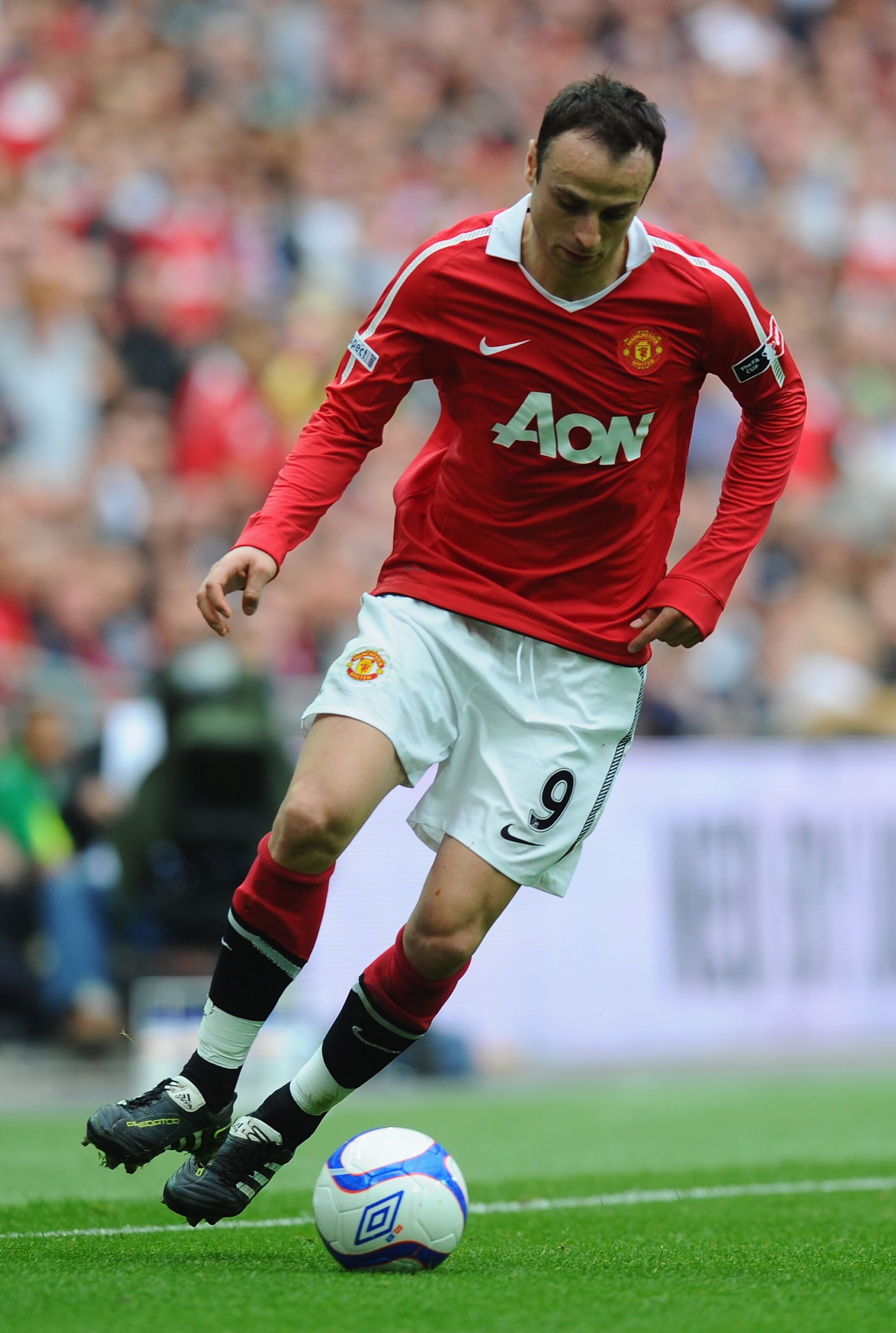 LONDON, ENGLAND - APRIL 16:  Dimitar Berbatov of Manchester United  runs with the ball during the FA Cup sponsored by E.ON semi final match between Manchester City and Manchester United at Wembley Stadium on April 16, 2011 in London, England.  (Photo by M