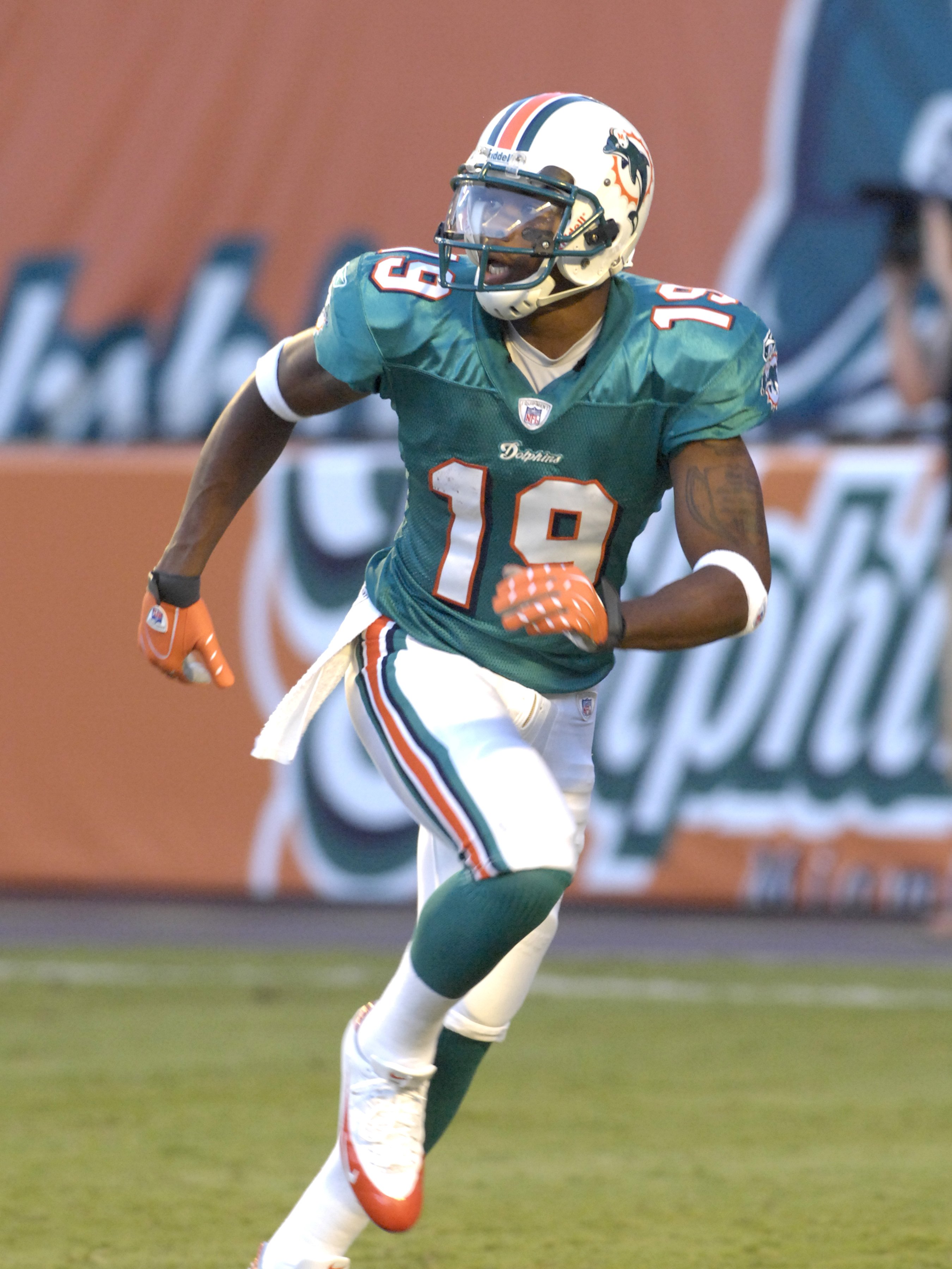 MIAMI, FL - AUGUST 11: Wide receiver Ted Ginn Jr. #19 of the Miami Dolphins  warms up for play  against the Jacksonville Jaguars at Dolphin Stadium on August 11, 2007 in Miami, Florida. (Photo by Al Messerschmidt/Getty Images)