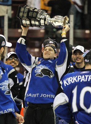 MISSISSAUGA, CANADA - MAY 29:  Nathan Beaulieu #28 of the Saint John Sea Dogs celebrates with the Memorial Cup after the win against the Mississauga St. Michael's Majors in the 2011 CHL Mastercard Memorial Cup final on May 29, 2011 at the Hershey Centre i