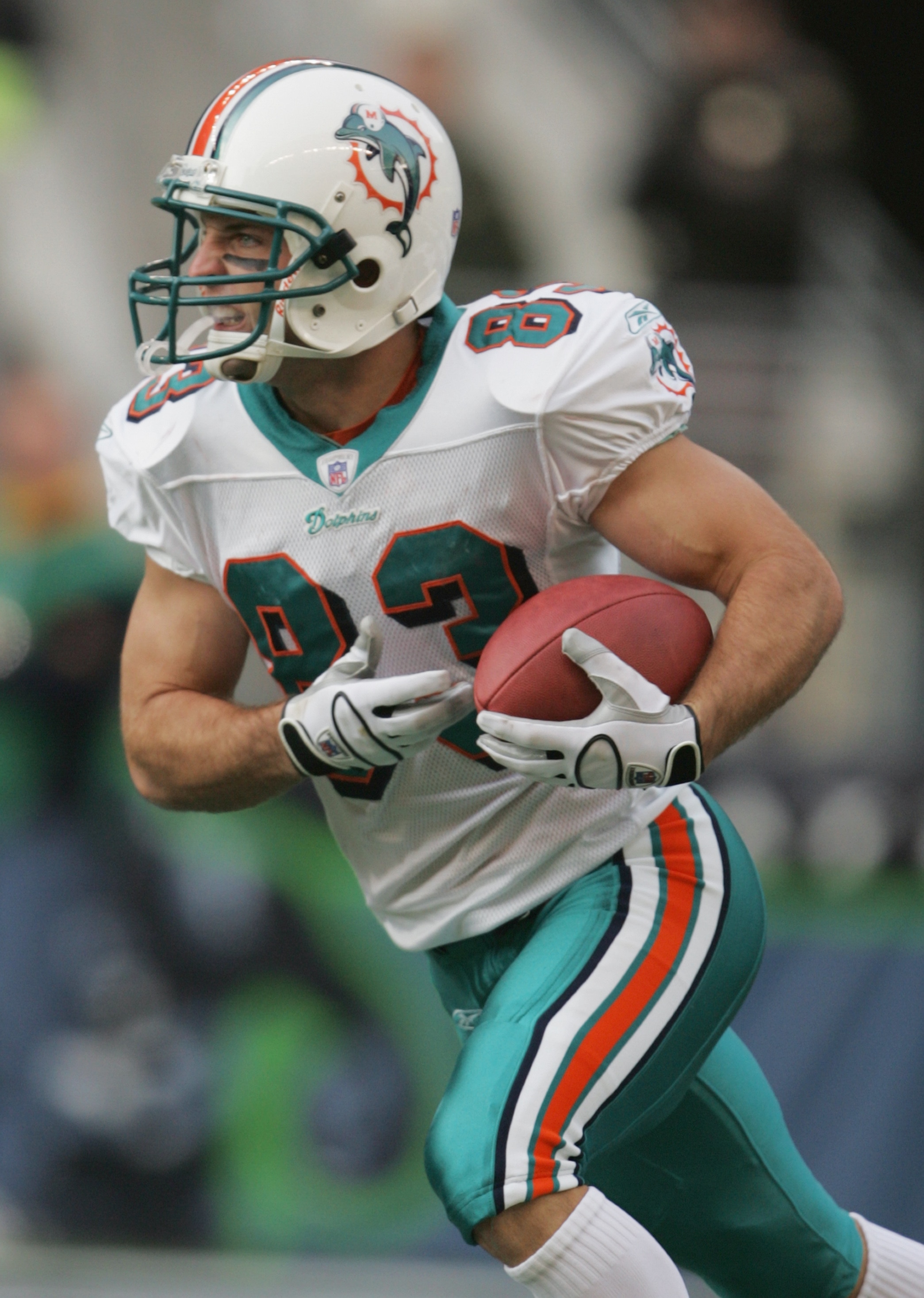 SEATTLE, WA - NOVEMBER 21: Wide receiver Wesley Welker #83 of the Miami Dolphins runs upfield against the Seattle Seahawks during the game at Qwest Field on November 21, 2004 in Seattle, Washington. The Seahawks defeated the Dolphins 24-17. (Photo by Jeff