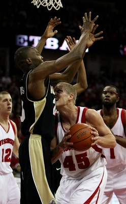 MADISON, WI - FEBRUARY 09: Joe Krabbenhoft #45 of the Wisconsin Badgers runs into JaJuan Johnson #25 of the Purdue Boilermakers as he tries to shoot on February 9, 2008 at the Kohl Center in Madison, Wisconsin. (Photo by Jonathan Daniel/Getty Images)