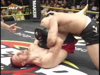 Nick Ring securing a triangle choke victory