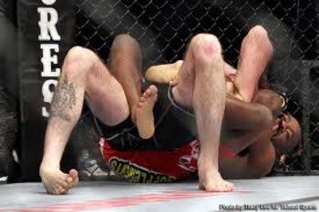 Yves Edwards locking in a rear-naked choke on Cody McKenzie