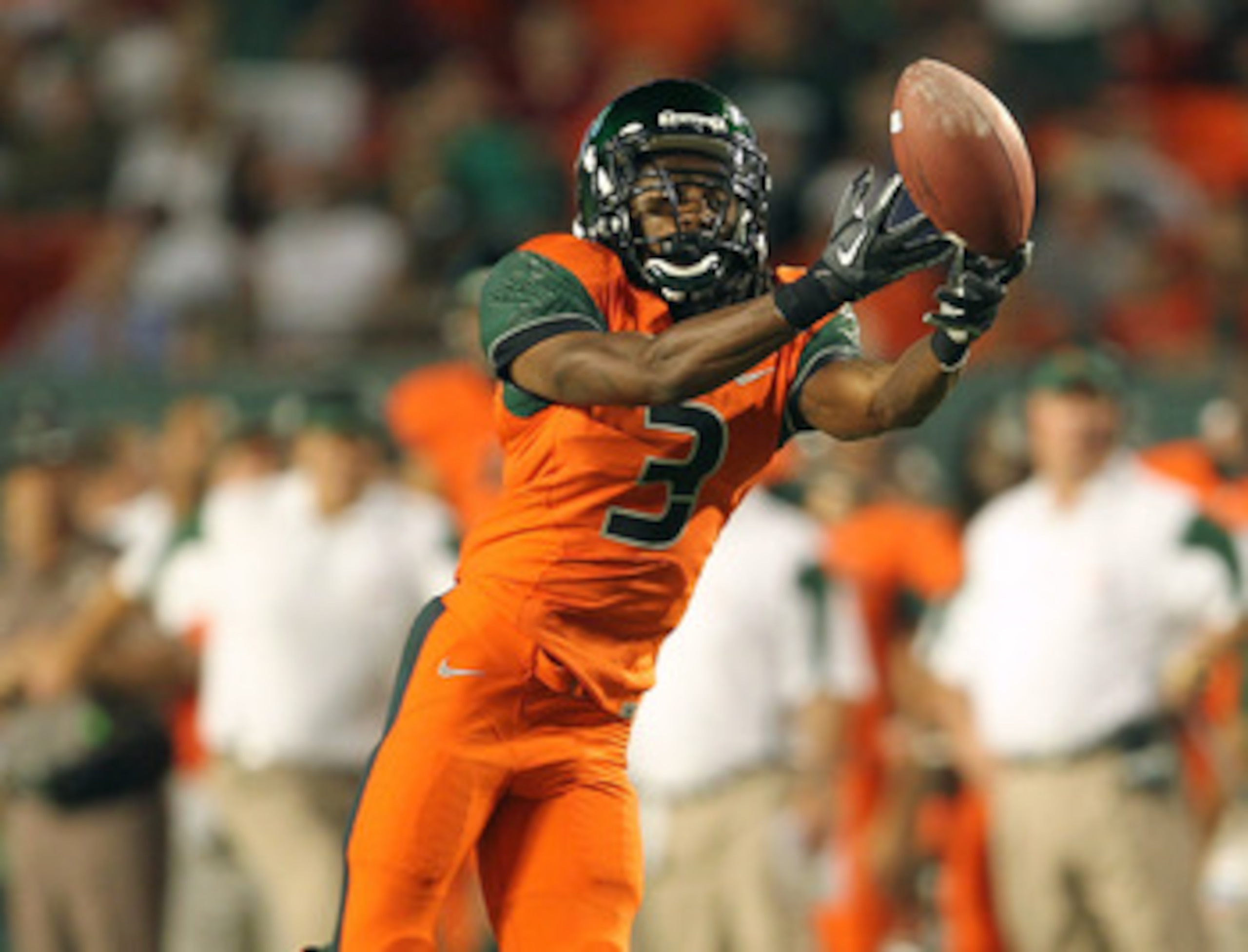 MIAMI - NOVEMBER 20:  Travis Benjamin #3 of the Miami Hurricanes misses a fingertip catch during a game against the Virginia Tech Hokies at Sun Life Stadium on November 20, 2010 in Miami, Florida.  (Photo by Mike Ehrmann/Getty Images)
