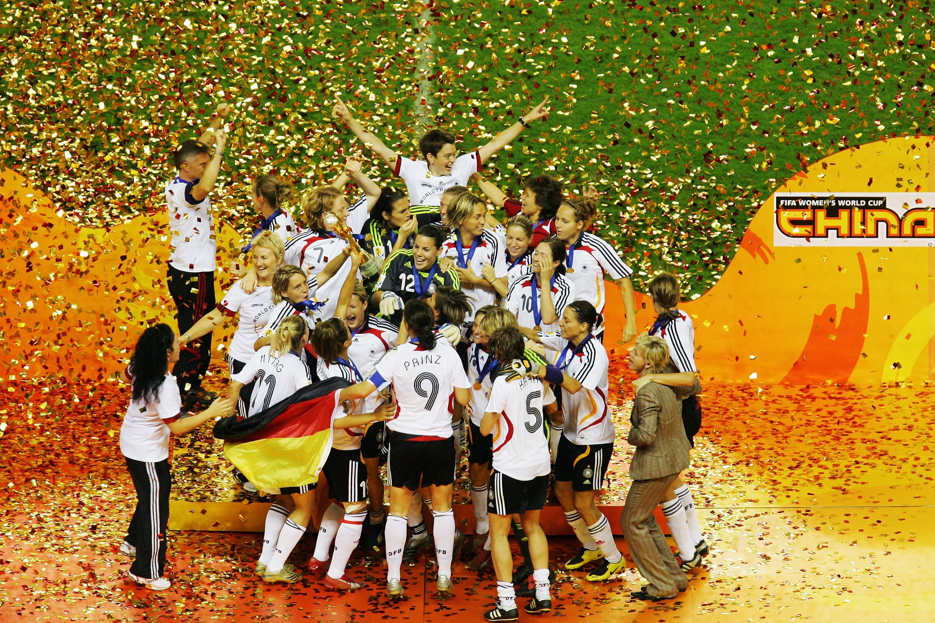 SHANGHAI, CHINA - SEPTEMBER 30:  The German team celebrate victory on the podium after winning the Women's World Cup 2007 Final match between Brazil and Germany at the Shanghai Hongkou Football Stadium September 30, 2007 in Shanghai, China.(Photo by Feng