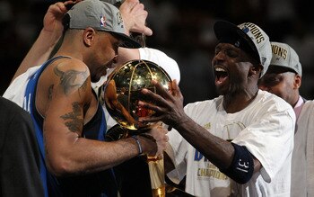 MIAMI, FL - JUNE 12:  (L-R) Shawn Marion #0 and Jason Terry #31 of the Dallas Mavericks celebrate with the Larry O'Brien trophy after the Mavericks won 105-95 against the Miami Heat in Game Six of the 2011 NBA Finals at American Airlines Arena on June 12,