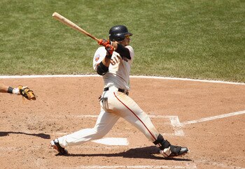 SAN FRANCISCO, CA - JUNE 08:  Brandon Crawford #35 of the San Francisco Giants hits a triple to score Cody Ross #13 of the San Francisco Giants in the seventh inning against the Washington Nationals at AT&T Park on June 8, 2011 in San Francisco, Californi