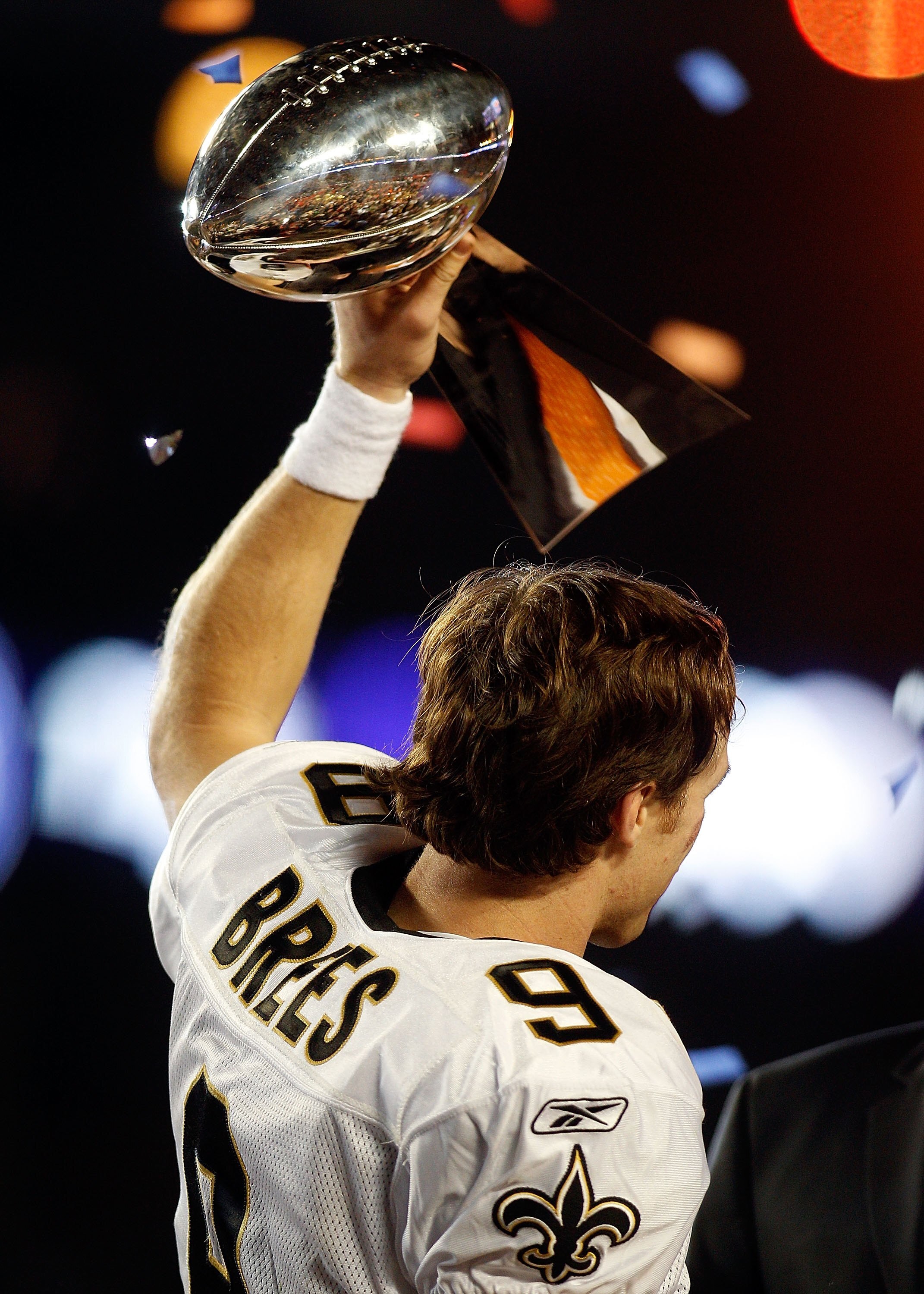 MIAMI GARDENS, FL - FEBRUARY 07:  Quarterback Drew Brees #9 of the New Orleans Saints celebrates with the Vince Lombardi Trophy after his team defeated the Indianapolis Colts during Super Bowl XLIV on February 7, 2010 at Sun Life Stadium in Miami Gardens,