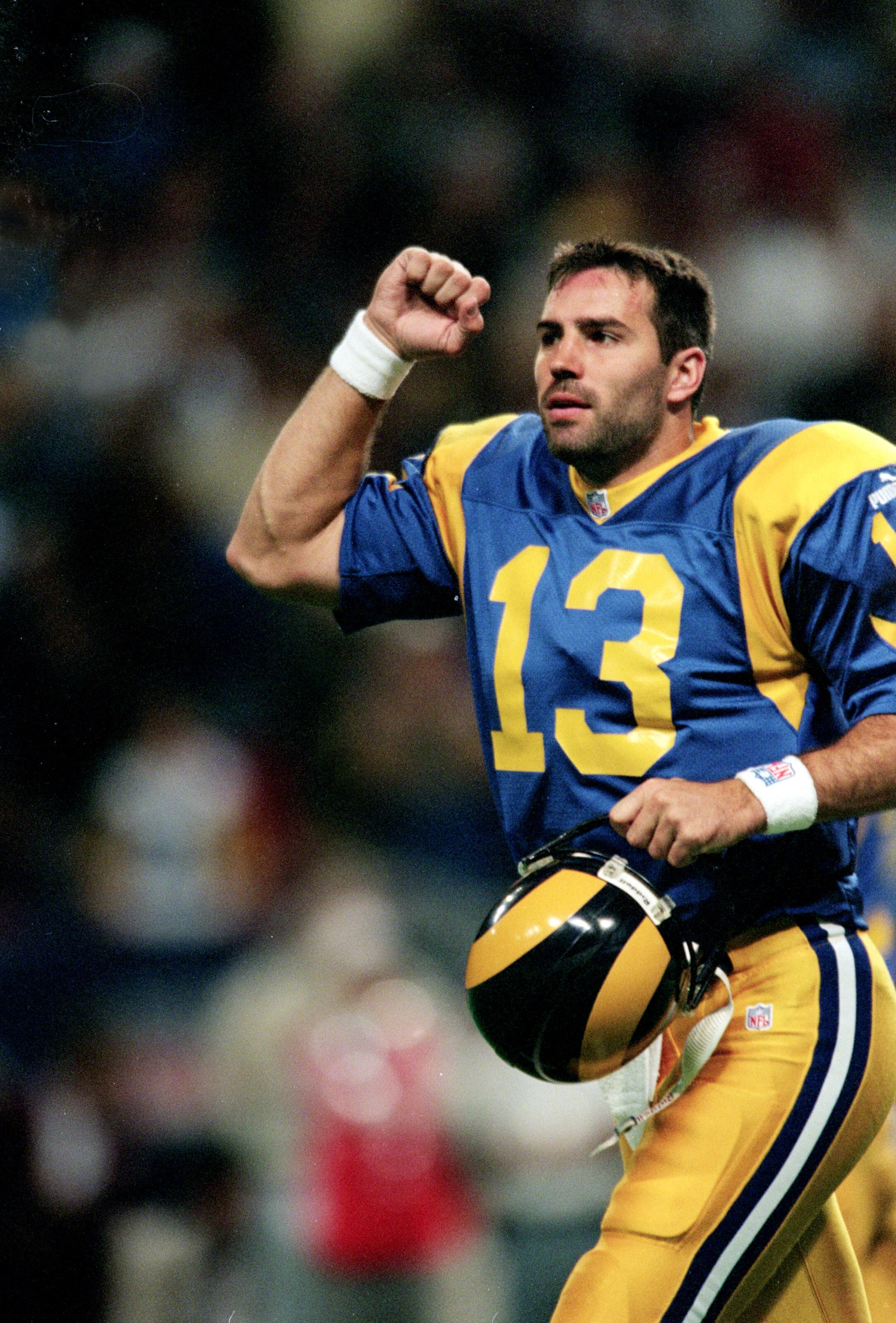 24 Oct 1999: Kurt Warner #13 of the St. Louis Rams celebrates on the field during the game against Cleveland Browns at the Trans World Dome in St. Louis, Missouri. The Rams defeated the Browns 34-3. Mandatory Credit: Elsa Hasch  /Allsport