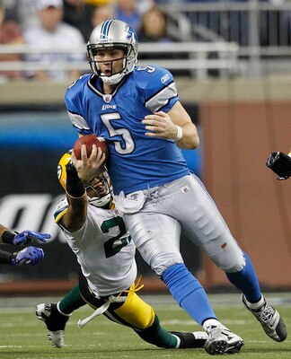 DETROIT - DECEMBER 12: Drew Stanton #5 of the Detroit Lions runs for a first down as Charles Woodson #21 of the Green Bay Packers attempts to make the stop during the game at Ford Field on December 12, 2010 in Detroit, Michigan. The Lions defeated the Pac DETROIT - DECEMBER 12: Drew Stanton #5 of the Detroit Lions runs for a first down as Charles Woodson #21 of the Green Bay Packers attempts to make the stop during the game at Ford Field on December 12, 2010 in Detroit, Michigan. The Lions defeated the Pac