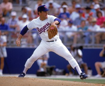 ARLINGTON, TX - 1990s:  Nolan Ryan #34 of the Texas Rangers pitches during a circa 1990s game at Arlington Stadium in Arlington, Texas. Ryan pitched for the Rangers from 1989-93.  (Photo by Jonathan Daniel/Getty Images)