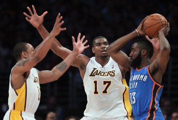 LOS ANGELES, CA - APRIL 10:  Andrew Bynum #17 of the Los Angeles Lakers defends James Harden #13 of the Oklahoma City Thunder in the first half at Staples Center on April 10, 2011 in Los Angeles, California. The Thunder defeated the Lakers 120-106. NOTE T