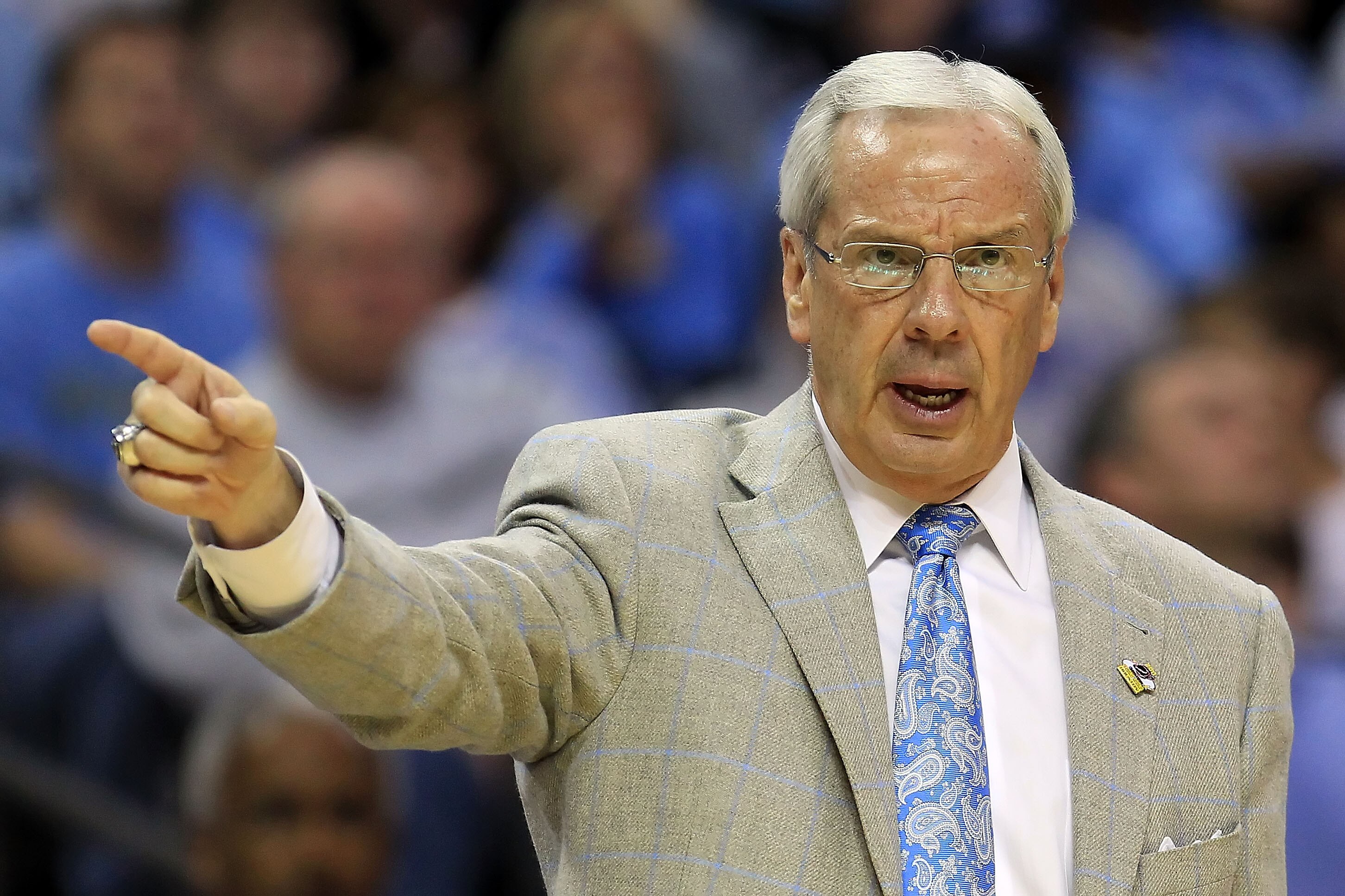 CHARLOTTE, NC - MARCH 18:  Head coach Roy Williams of the North Carolina Tar Heels points in the second half while taking on the Long Island Blackbirds during the second round of the 2011 NCAA men's basketball tournament at Time Warner Cable Arena on Marc