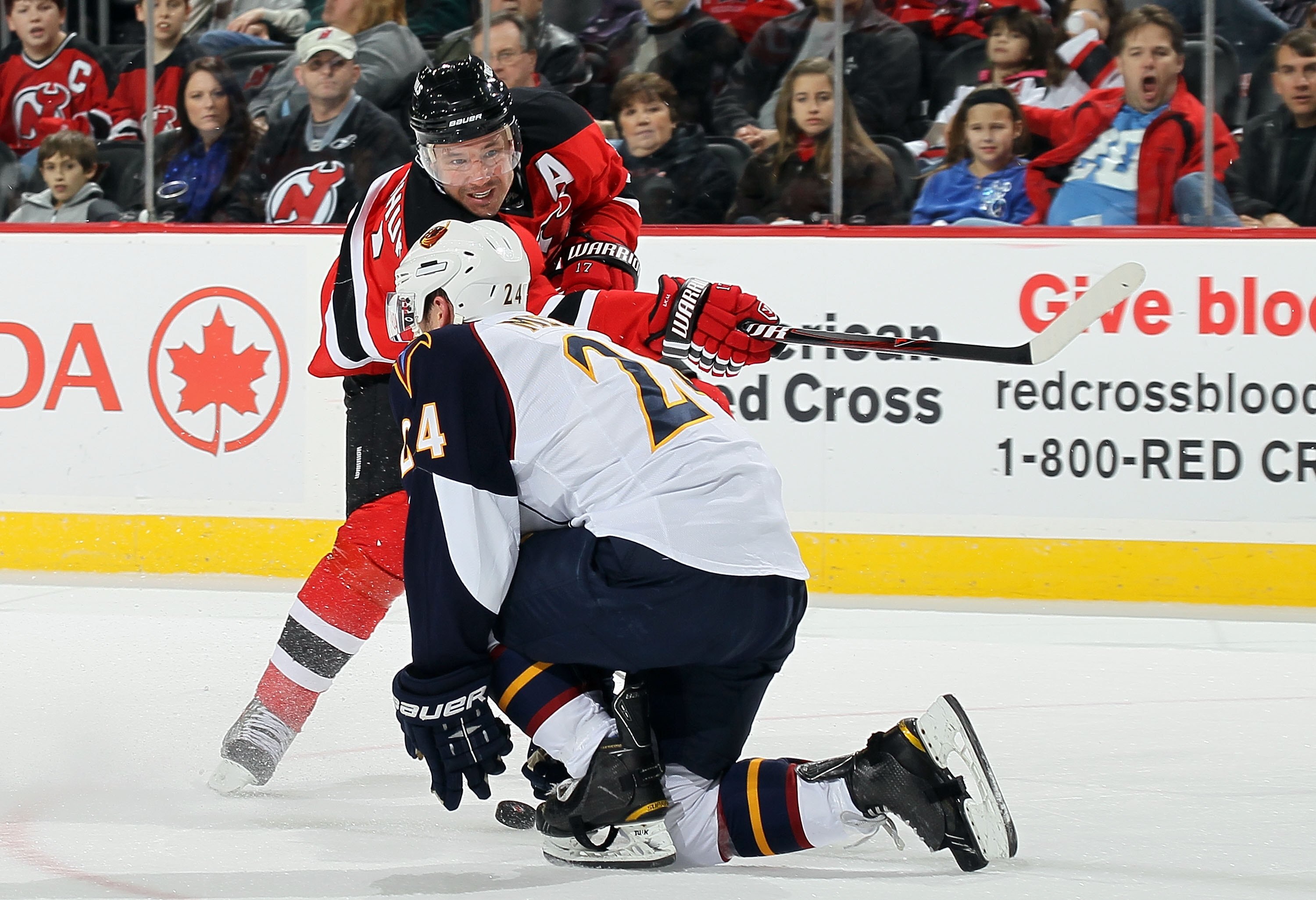 NEWARK, NJ - DECEMBER 31:  Ilya Kovalchuk #17 of the New Jersey Devils skates against Freddy Meyer #24 of the Atlanta Thrashers at the Prudential Center on December 31, 2010 in Newark, New Jersey.  (Photo by Jim McIsaac/Getty Images)