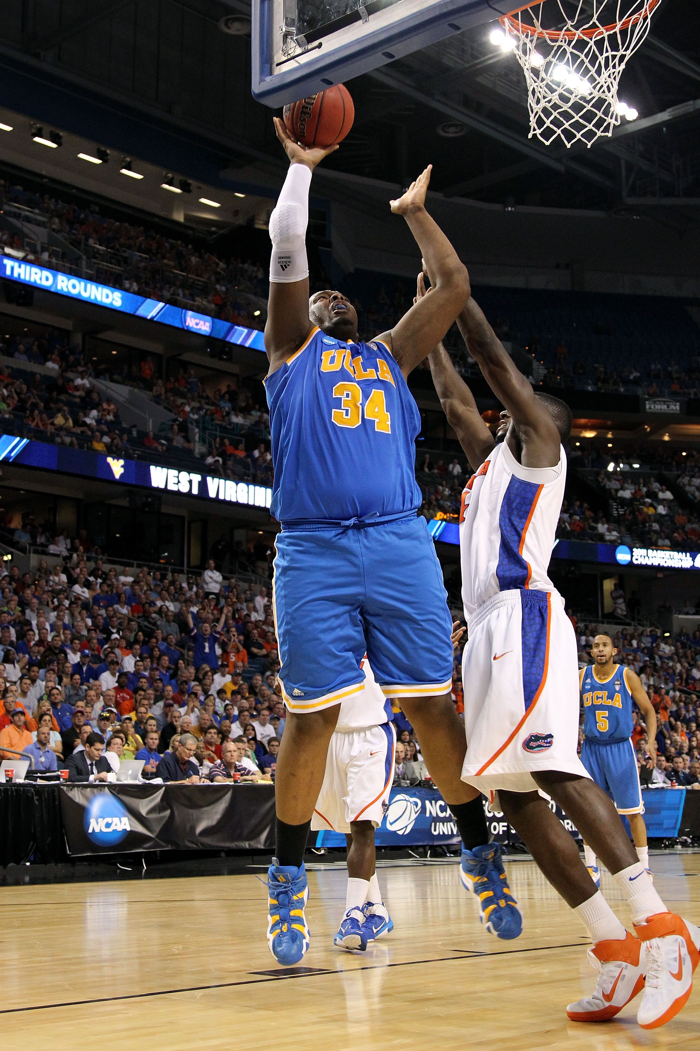 TAMPA, FL - MARCH 19:  Joshua Smith #34 of the UCLA Bruins attempts a shot against the Florida Gators during the third round of the 2011 NCAA men's basketball tournament at St. Pete Times Forum on March 19, 2011 in Tampa, Florida. Florida won 73-65.  (Pho