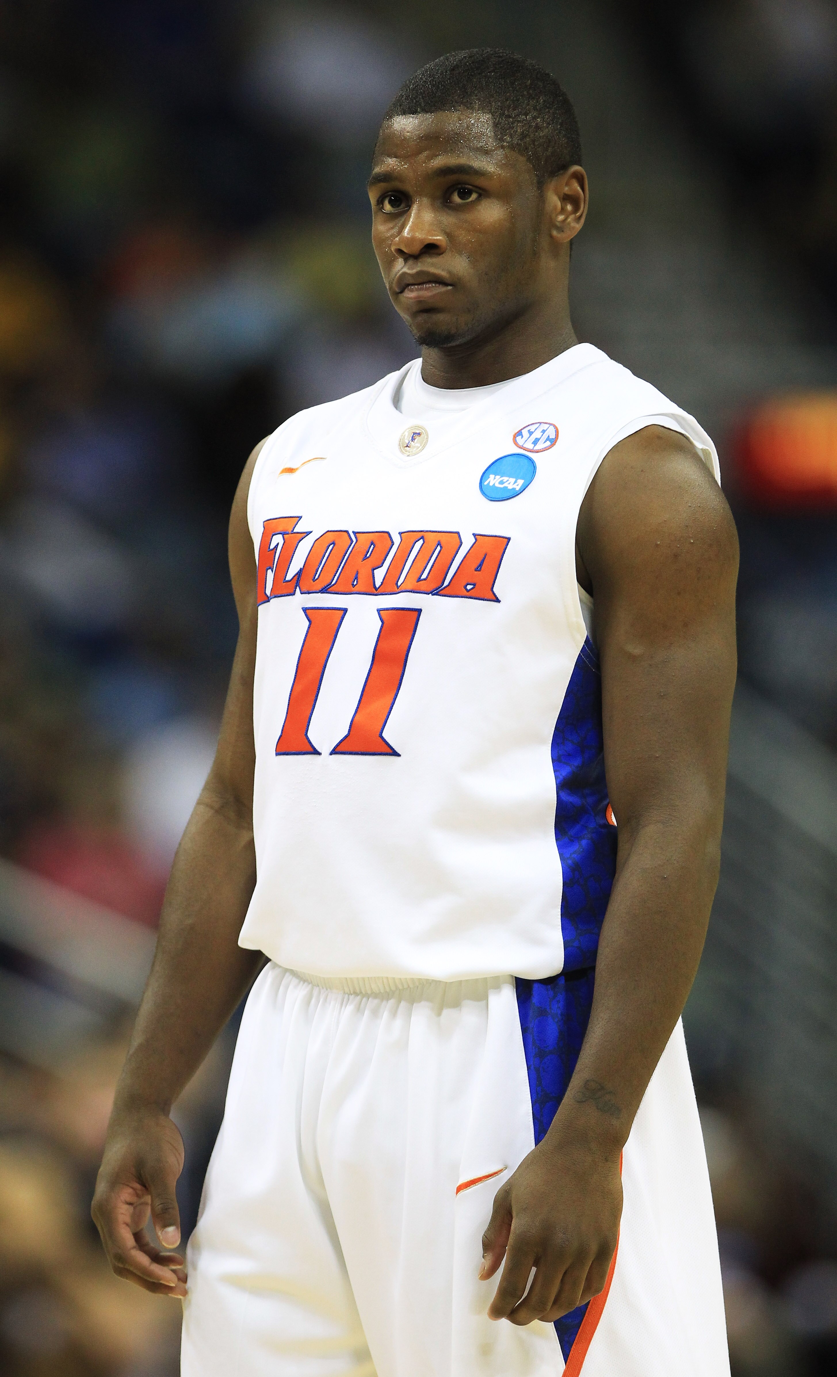 NEW ORLEANS, LA - MARCH 26:  Erving Walker #11 of the Florida Gators reacts during their game against the Butler Bulldogs in the Southeast regional final of the 2011 NCAA men's basketball tournament at New Orleans Arena on March 26, 2011 in New Orleans, L