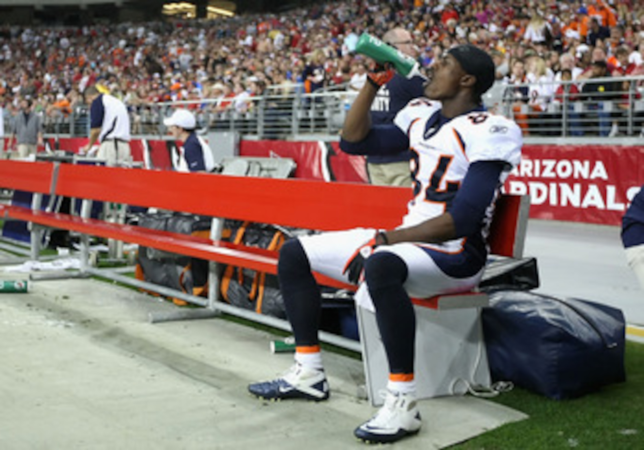 GLENDALE, AZ - DECEMBER 12:  Wide receiver Brandon Lloyd #84 of the Denver Broncos drinks water on the bench during the NFL game against the Arizona Cardinals at the University of Phoenix Stadium on December 12, 2010 in Glendale, Arizona.  The Cardinals d