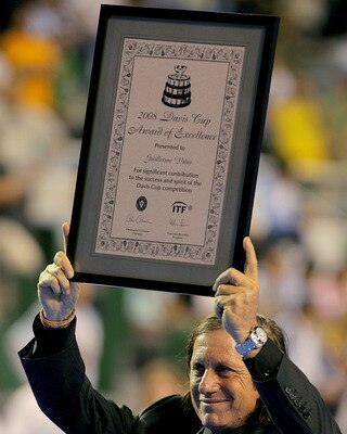 MAR DEL PLATA, ARGENTINA - NOVEMBER 22: Guilermo Vilas displays an Award of Excellence presented to him before the third rubber of the Davis Cup final at Estadia Islas Malinas November 22, 2008 in Mar del Plata, Argentina.  (Photo by Matthew Stockman/Gett