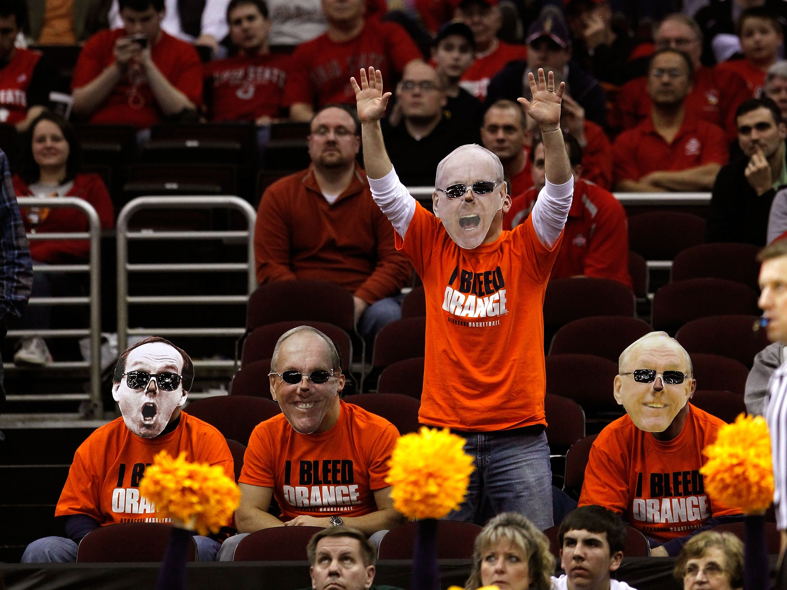 CLEVELAND, OH - MARCH 20:  Fans wear head coach Jim Boeheim of the Syracuse Orange masks during the game between the Syracuse Orange and the Marquette Golden Eagles during the third of the 2011 NCAA men's basketball tournament at Quicken Loans Arena on Ma