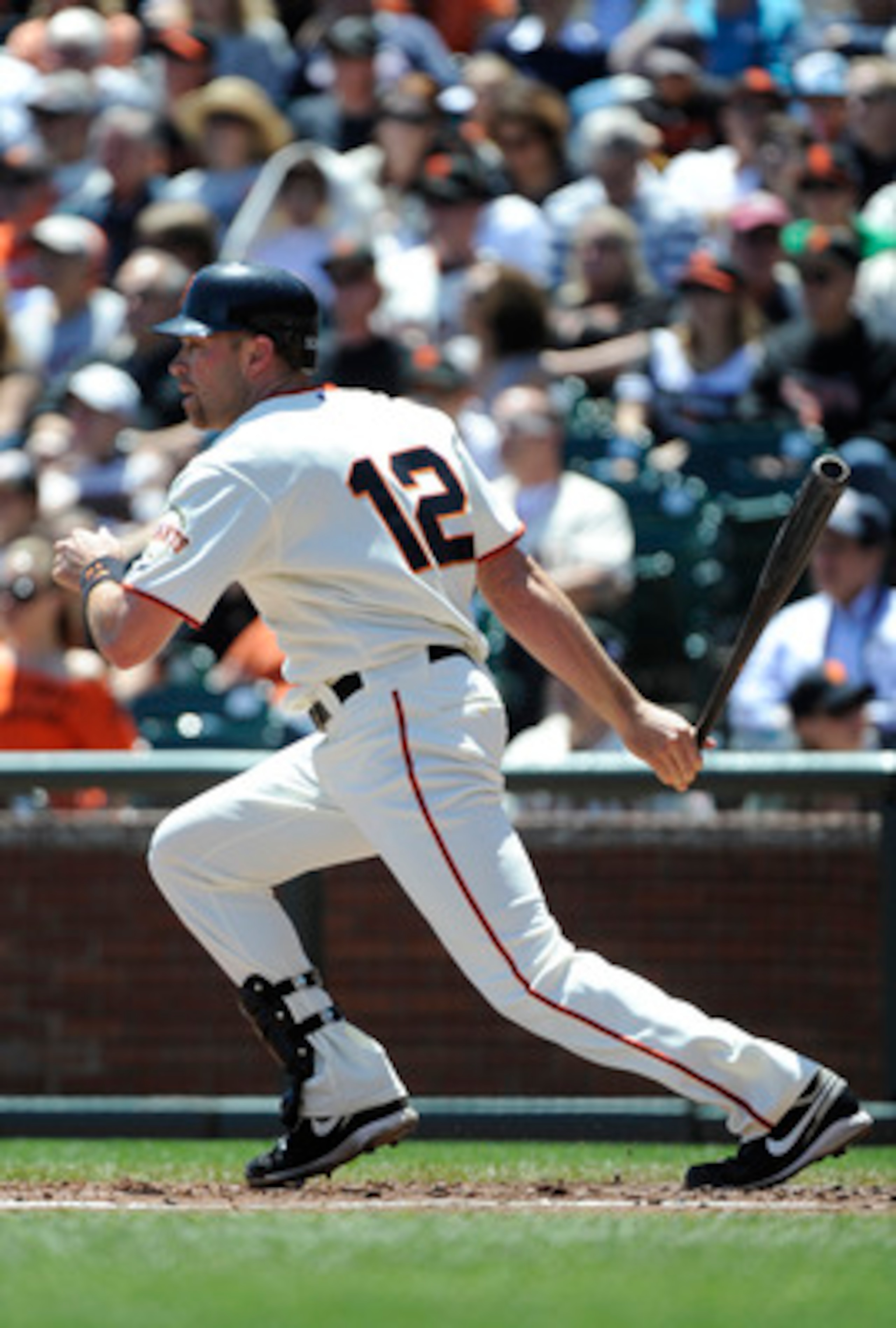 SAN FRANCISCO, CA - MAY 12: Nate Schierholtz #12 of the San Francisco Giants hits an RBI single in the bottom of the second inning against the Arizona Diamondbacks during a MLB baseball game at AT&T Park May 12, 2011 in San Francisco, California. (Photo b