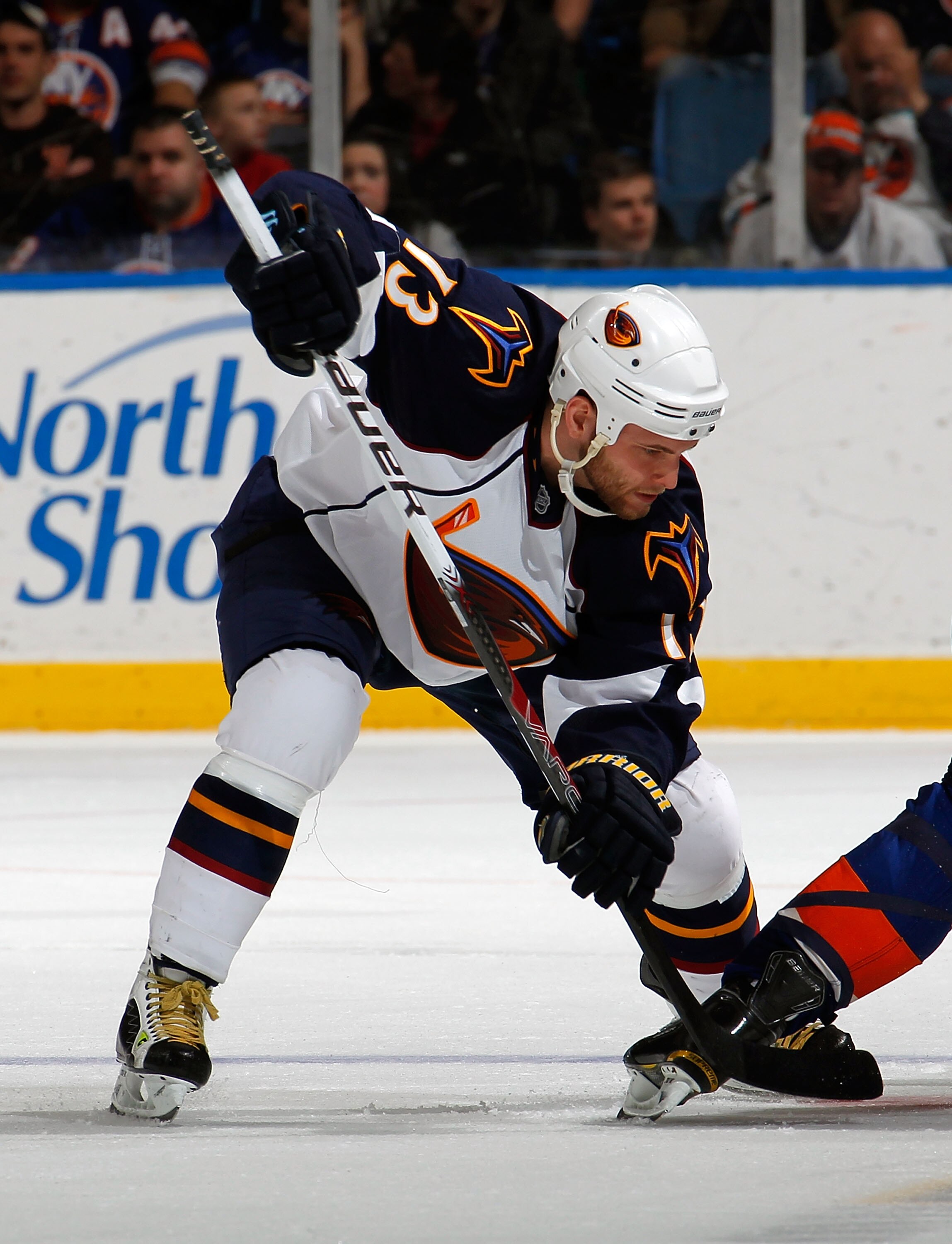 UNIONDALE, NY - MARCH 24:  Rob Schremp #13 of the Atlanta Thrashers takes a faceoff during an NHL hockey game against the New York Islanders at the Nassau Coliseum on March 24, 2011 in Uniondale, New York.  (Photo by Paul Bereswill/Getty Images)