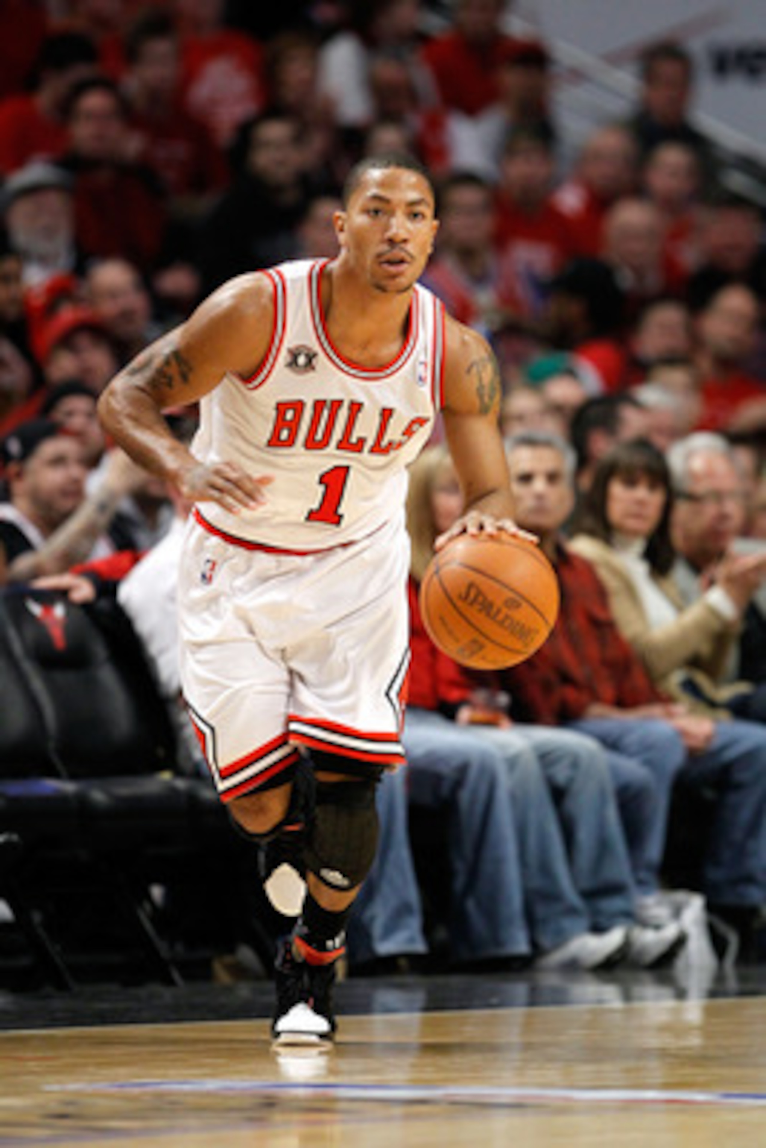 CHICAGO, IL - MAY 15:  Derrick Rose #1 of the Chicago Bulls brings the ball up court against the Miami Heat in Game One of the Eastern Conference Finals during the 2011 NBA Playoffs on May 15, 2011 at the United Center in Chicago, Illinois. The Bulls won 