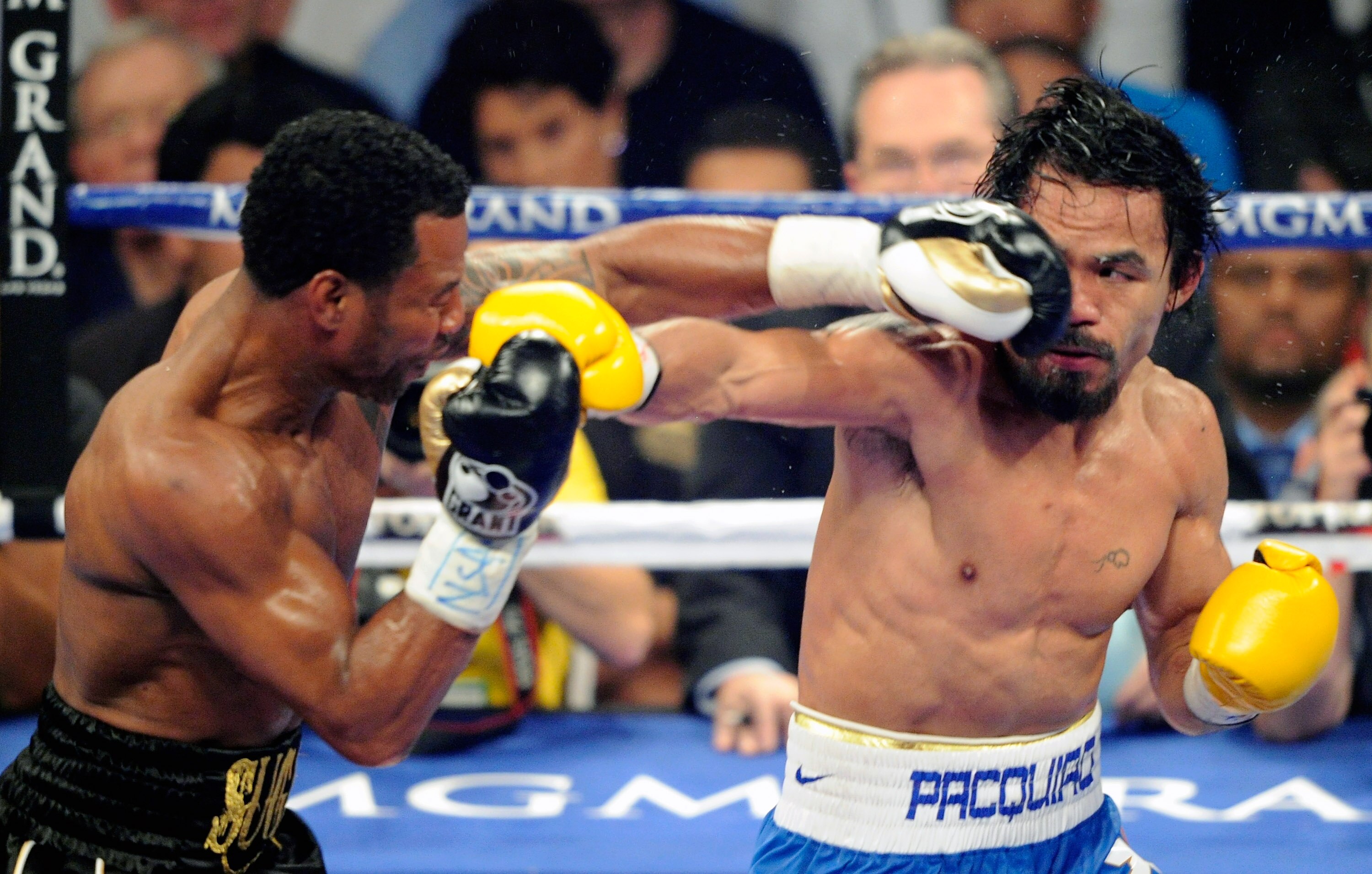 LAS VEGAS, NV - MAY 07:  Shane Mosley (L) and Manny Pacquiao battle in the fifth round of their WBO welterweight title fight at the MGM Grand Garden Arena May 7, 2011 in Las Vegas, Nevada. Pacquiao retained his title with a unanimous-decision victory.  (P