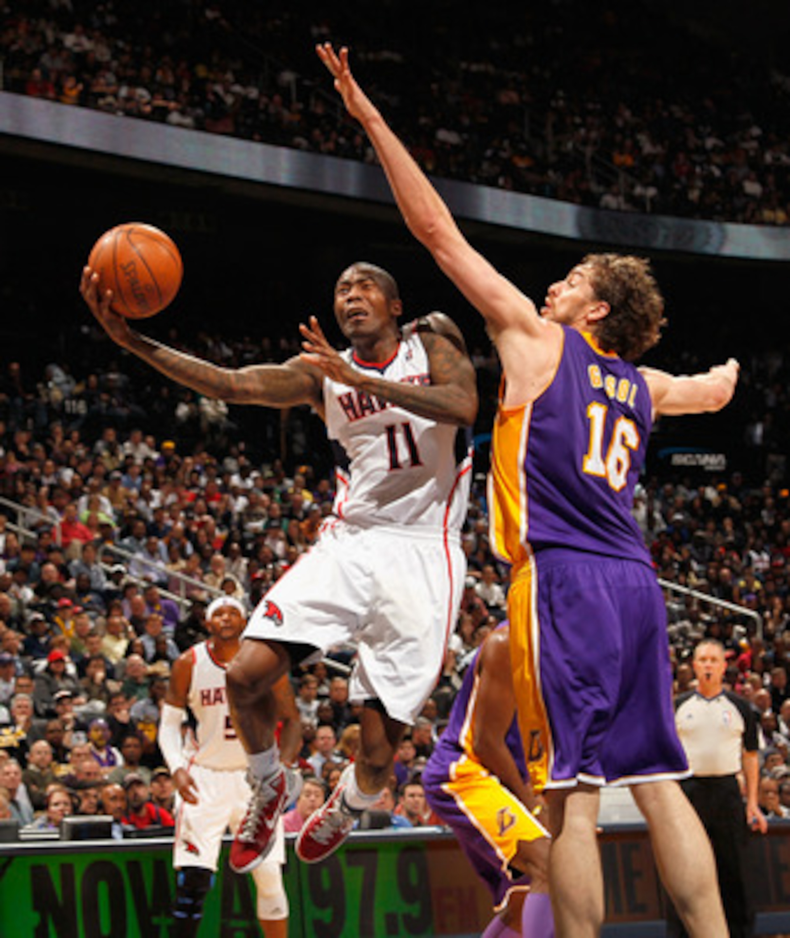 ATLANTA, GA - MARCH 08:  Pau Gasol #16 of the Los Angeles Lakers defends against Jamal Crawford #11 of the Atlanta Hawks at Philips Arena on March 8, 2011 in Atlanta, Georgia.  NOTE TO USER: User expressly acknowledges and agrees that, by downloading and/