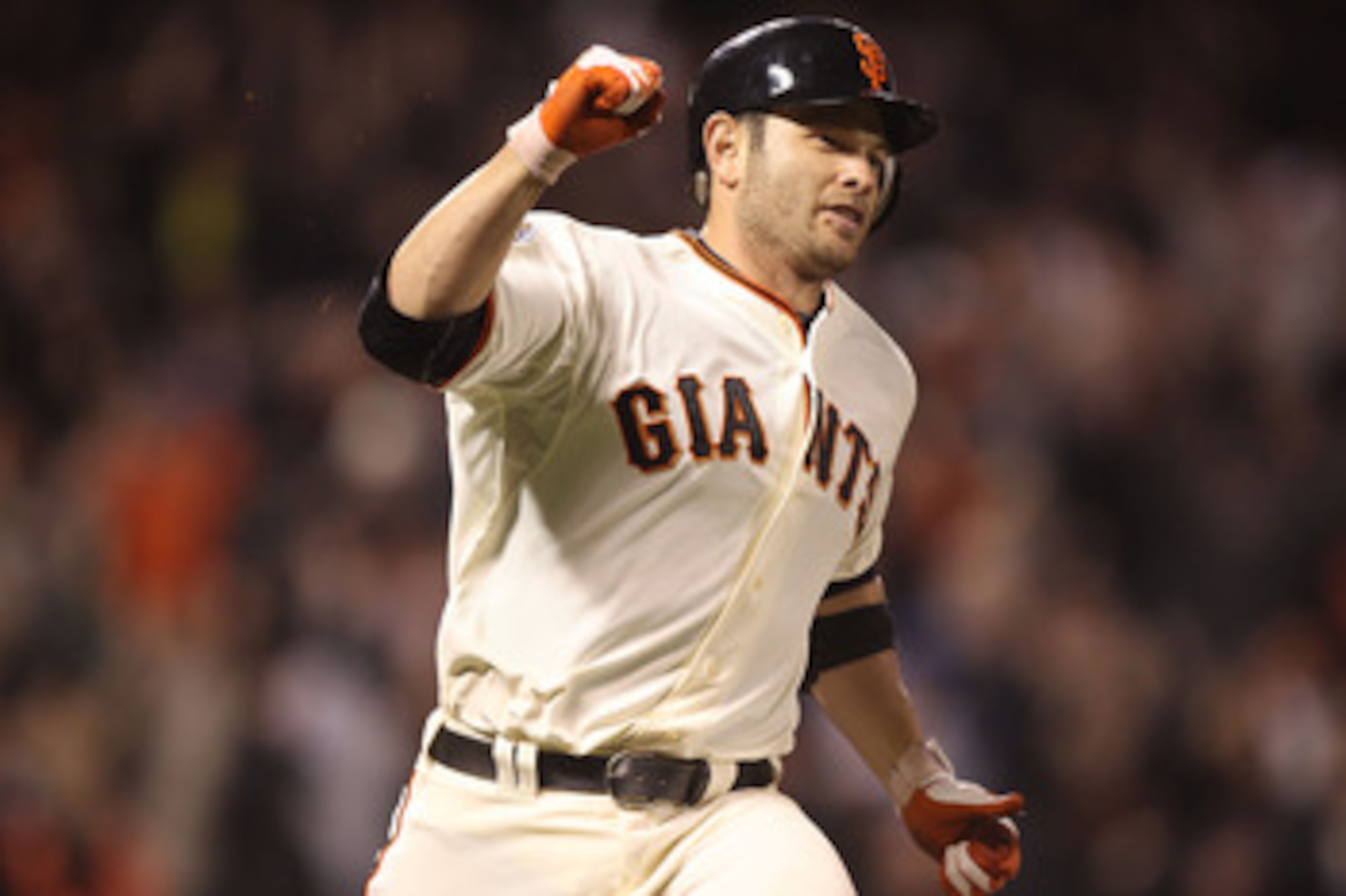 SAN FRANCISCO, CA - JUNE 06:  Freddy Sanchez #21 of the San Francisco Giants celebrates after the game winning hit in the 13th inning against the Washington Nationals during an MLB game at AT&T Park on June 6, 2011 in San Francisco, California.  (Photo by