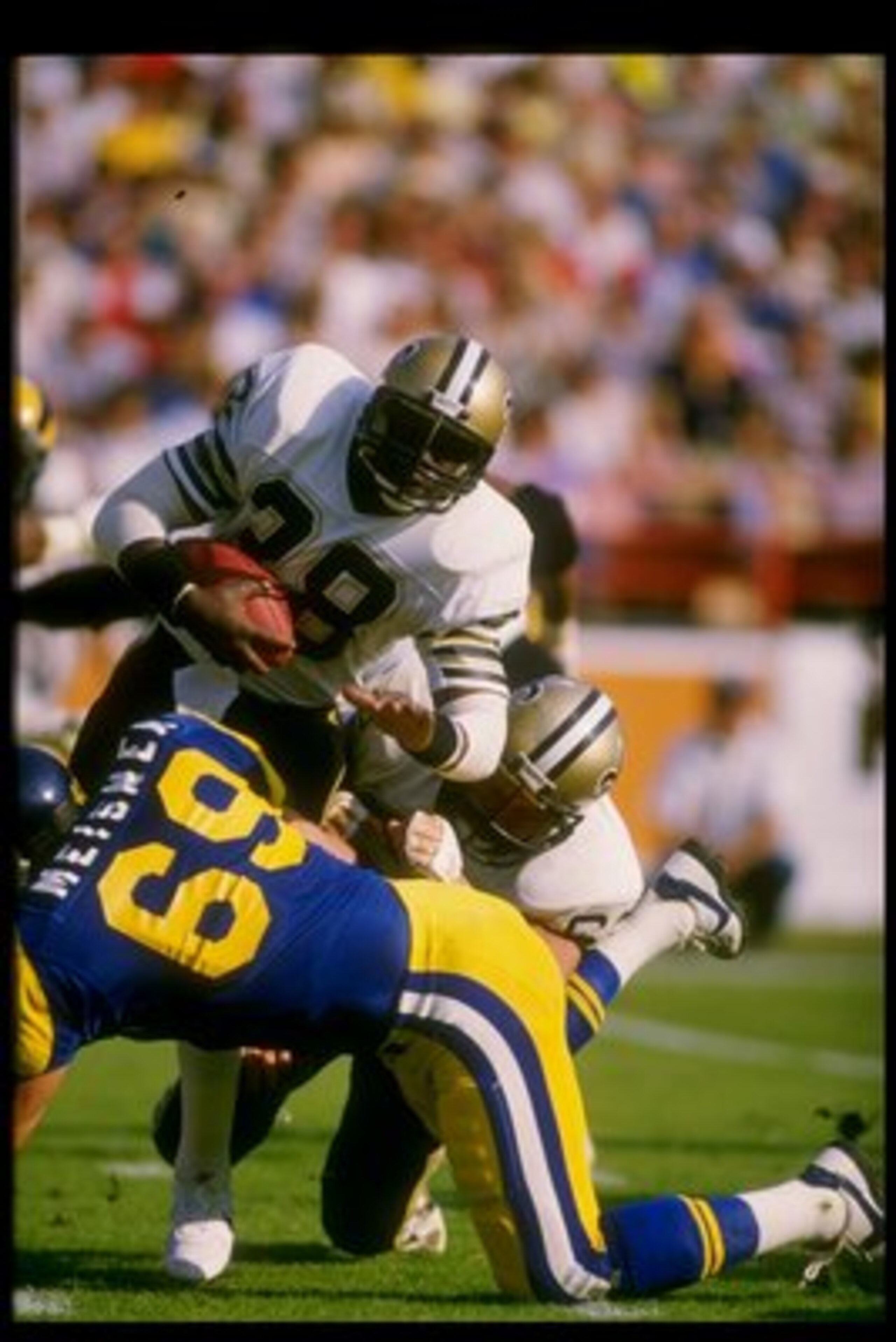 1988:  Halfback George Rogers of the New Orleans Saints runs with the ball during a game against the Los Angeles Rams at Anaheim Stadium in Anaheim, California. Mandatory Credit: Rick Stewart  /Allsport