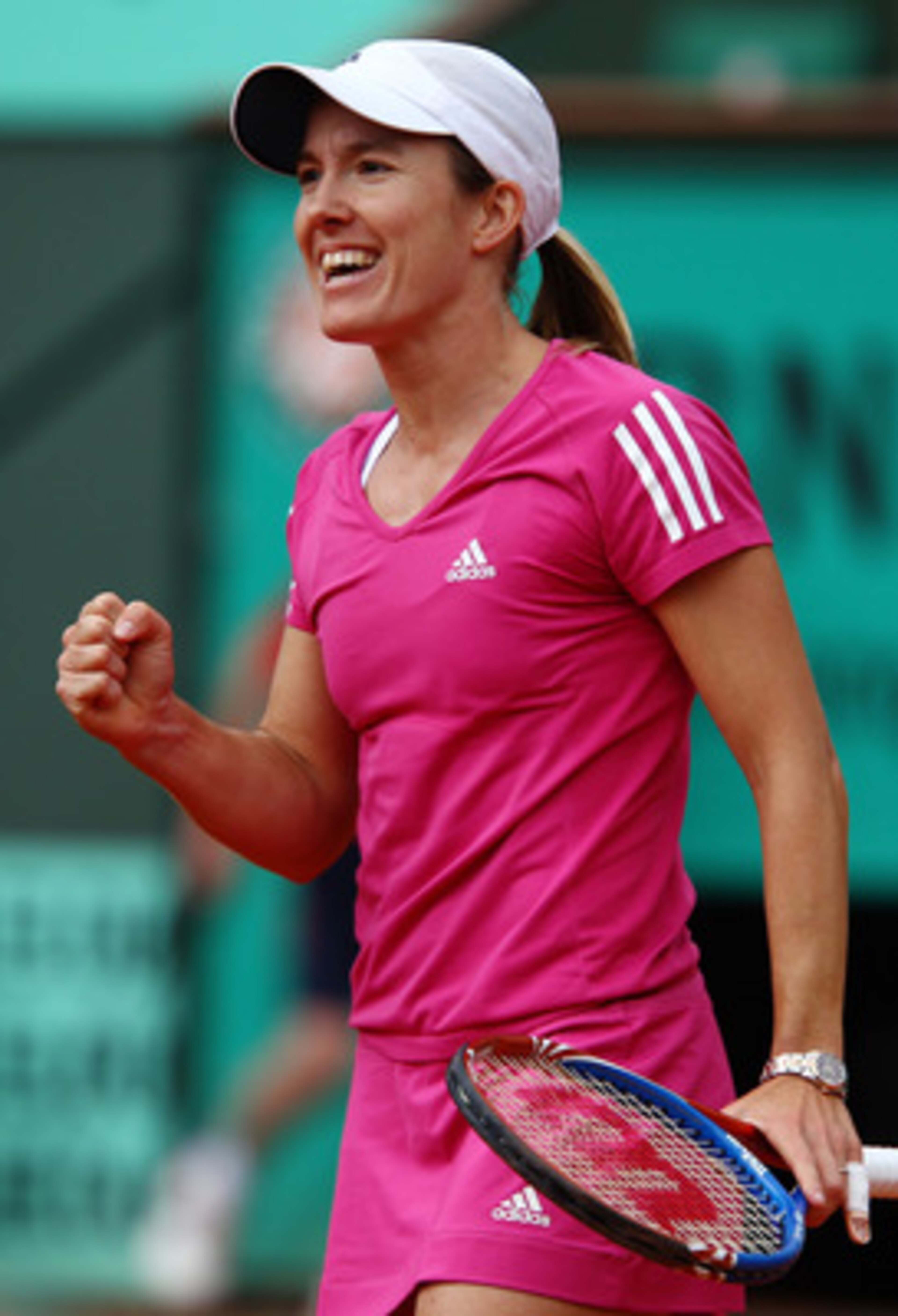 PARIS - MAY 30:  Justine Henin of Belgium celebrates winning match point during the women's singles third round match between Justine Henin of Belgium and Maria Sharapova of Russia on day eight of the French Open at Roland Garros on May 30, 2010 in Paris,