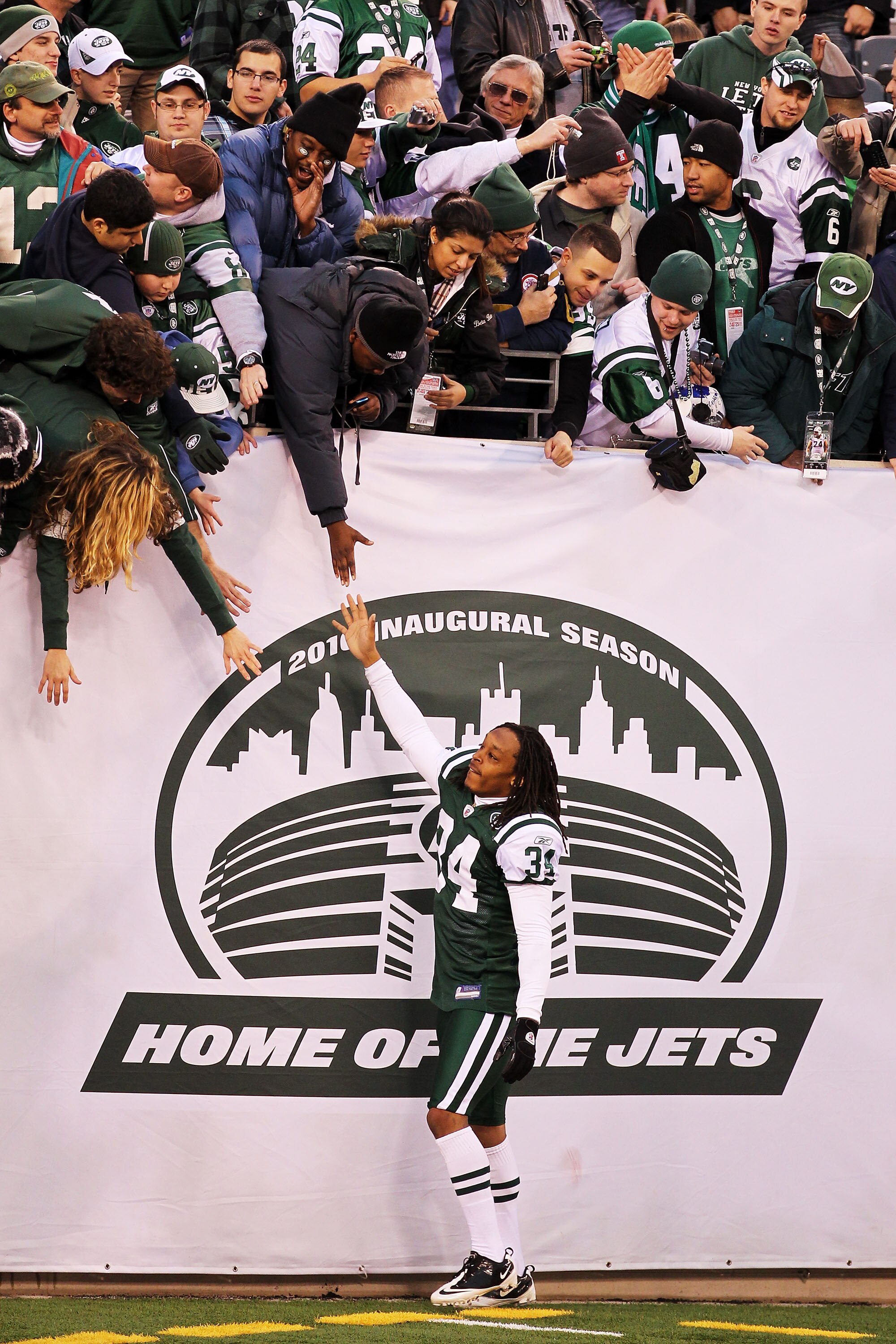 EAST RUTHERFORD, NJ - JANUARY 02:  Marquice Cole #34 of the New York Jets celebrates with fans after they defeated the Buffalo Bills 38 to 7 at New Meadowlands Stadium on January 2, 2011 in East Rutherford, New Jersey.  (Photo by Al Bello/Getty Images)