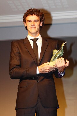 PARIS - JUNE 01:  Gustavo Kuerten of Brazil poses with the Philippe Chatrier Award at the ITF World Champions Gala on day ten of the French Open on June 1, 2010 in Paris, France.  (Photo by Clive Brunskill/Getty Images)