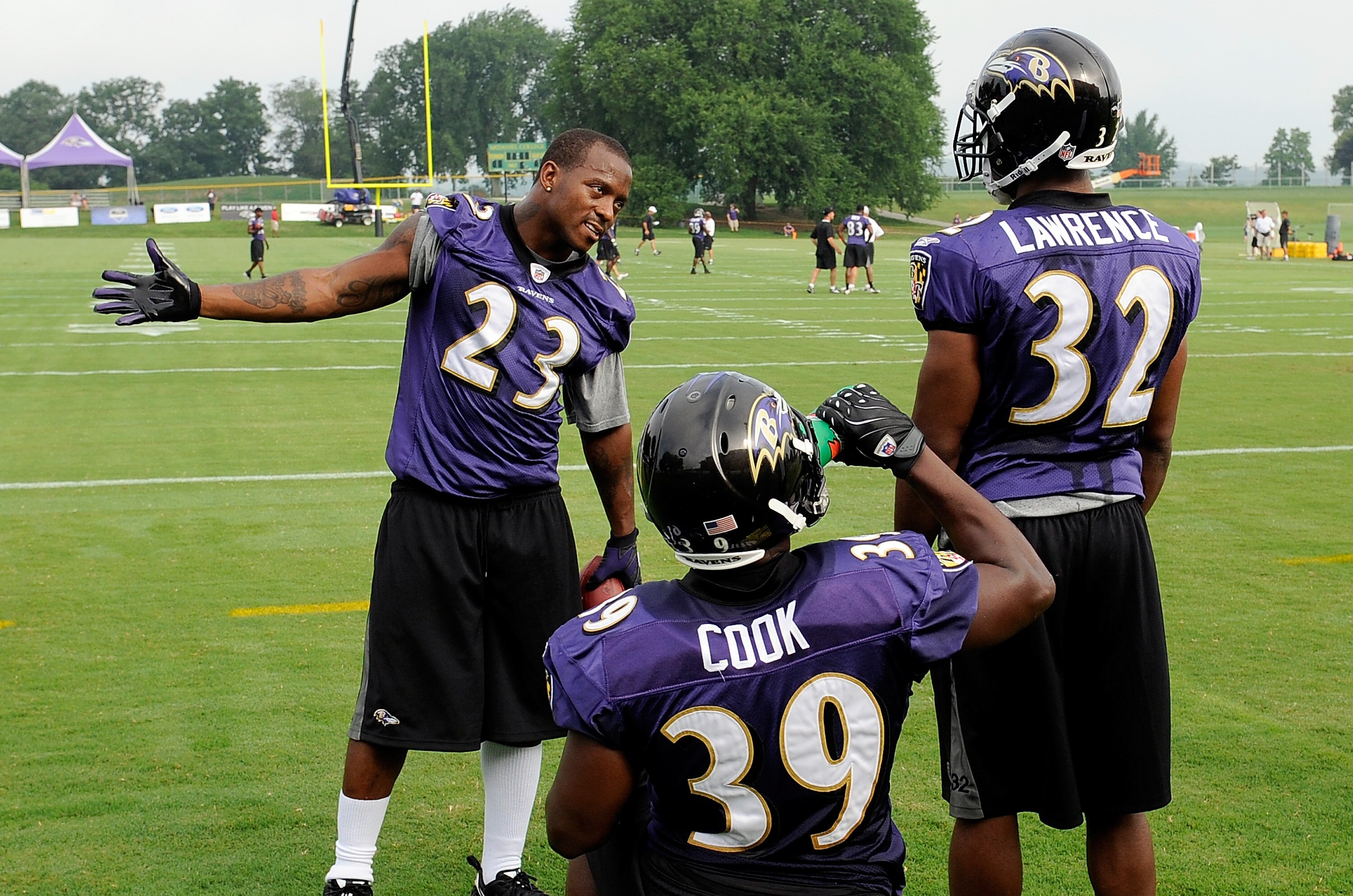 WESTMINSTER, MD - JULY 28:  Willis McGahee #23 of the Baltimore Ravens talks to Jason Cook #39 and Matt Lawrence #32 during training camp at McDaniel College on July 28, 2009 in Westminster, Maryland.  (Photo by Greg Fiume/Getty Images)