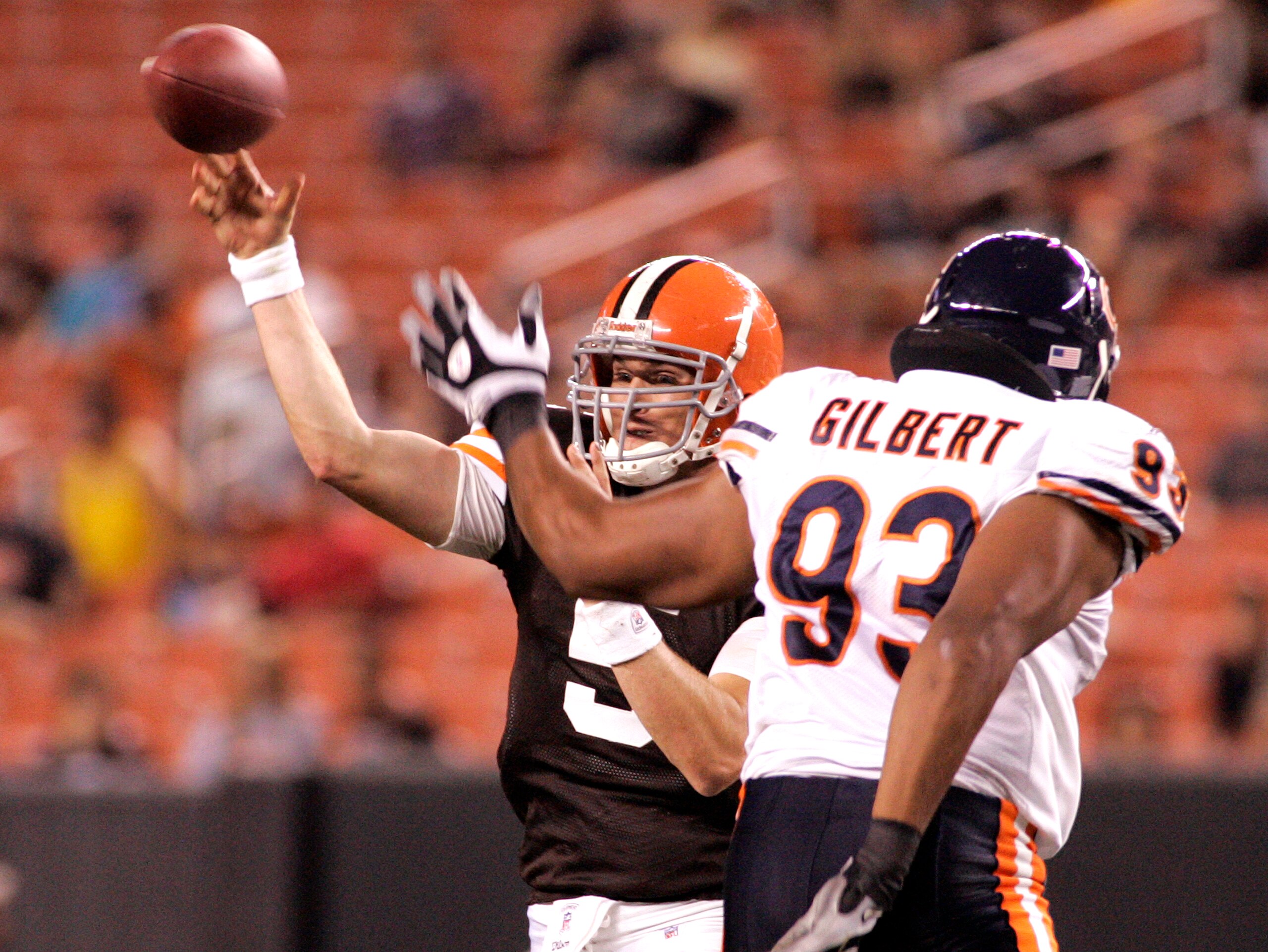 CLEVELAND - SEPTEMBER 2:  Brett Ratliff #5 of the Cleveland Browns passes through pressure from Jarron Gilbert #93 of the Chicago Bears during the preseason game on September 2, 2010 at Cleveland Browns Stadium in Cleveland, Ohio. The Browns defeated the
