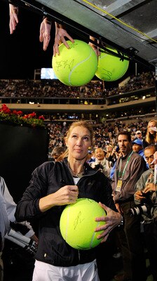 INDIAN WELLS, CA - MARCH 12:  Tennis legend Stefi Graf of Germany signs tennis balls after participating in Hit for Haiti, a charity event during the BNP Paribas Open on March 12, 2010 in Indian Wells, California.  (Photo by Kevork Djansezian/Getty Images