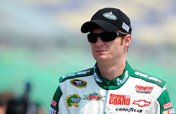 KANSAS CITY, KS - JUNE 04:  Dale Earnhardt Jr., driver of the #88 Amp Energy/National Guard Chevrolet, stands on the grid during qualifying for the NASCAR Sprint Cup Series STP 400 at Kansas Speedway on June 4, 2011 in Kansas City, Kansas.  (Photo by Jare