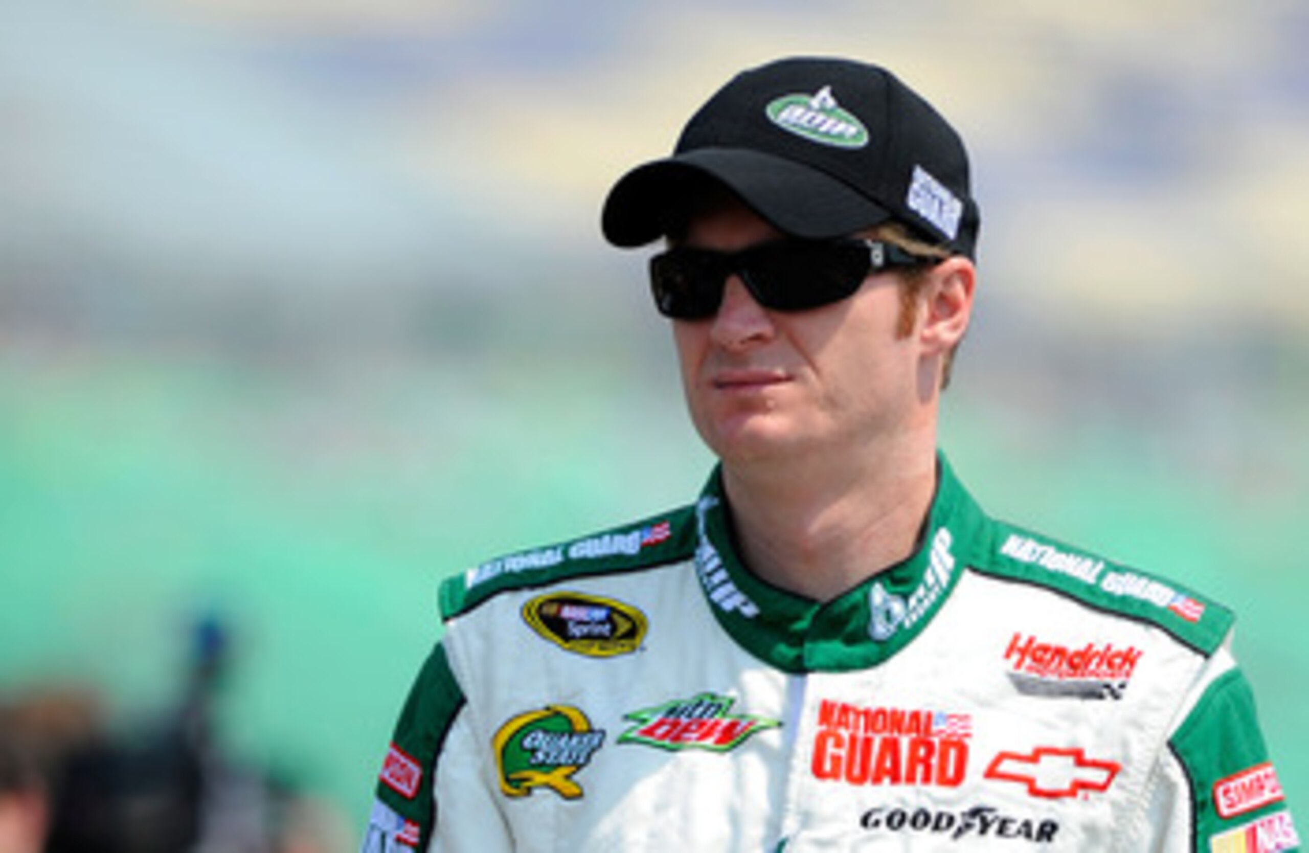 KANSAS CITY, KS - JUNE 04:  Dale Earnhardt Jr., driver of the #88 Amp Energy/National Guard Chevrolet, stands on the grid during qualifying for the NASCAR Sprint Cup Series STP 400 at Kansas Speedway on June 4, 2011 in Kansas City, Kansas.  (Photo by Jare