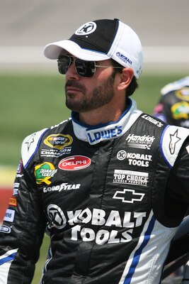 KANSAS CITY, KS - JUNE 05:  Jimmie Johnson, driver of the #48 Lowe's/Kobalt Tools Chevrolet, stands on the grid during the NASCAR Sprint Cup Series STP 400 at Kansas Speedway on June 5, 2011 in Kansas City, Kansas.  (Photo by Tim Umphrey/Getty Images for 