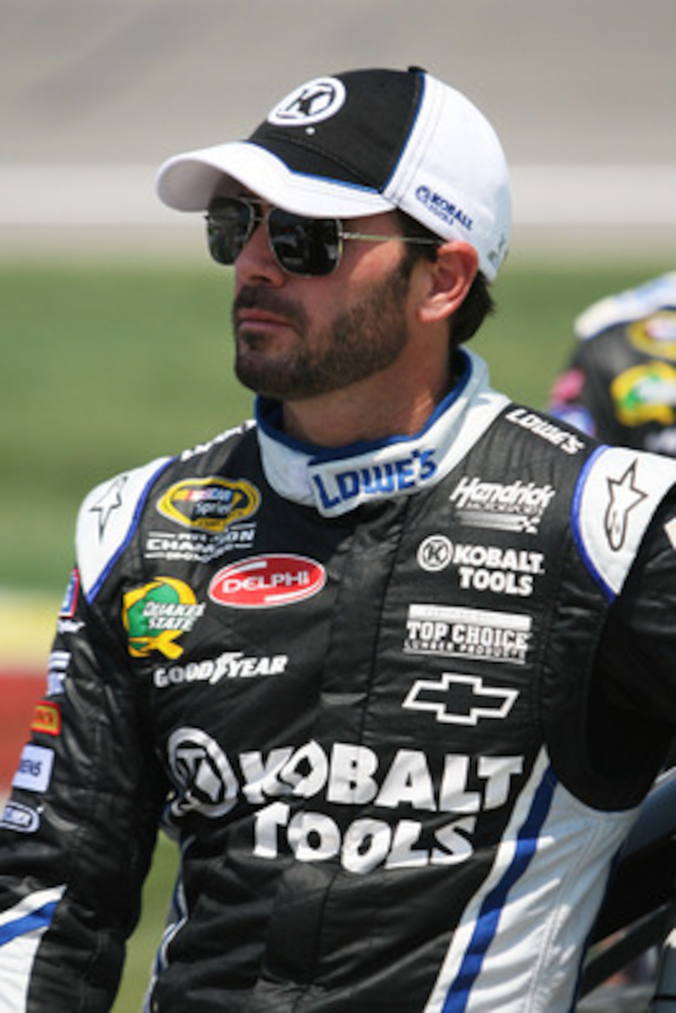 KANSAS CITY, KS - JUNE 05:  Jimmie Johnson, driver of the #48 Lowe's/Kobalt Tools Chevrolet, stands on the grid during the NASCAR Sprint Cup Series STP 400 at Kansas Speedway on June 5, 2011 in Kansas City, Kansas.  (Photo by Tim Umphrey/Getty Images for 