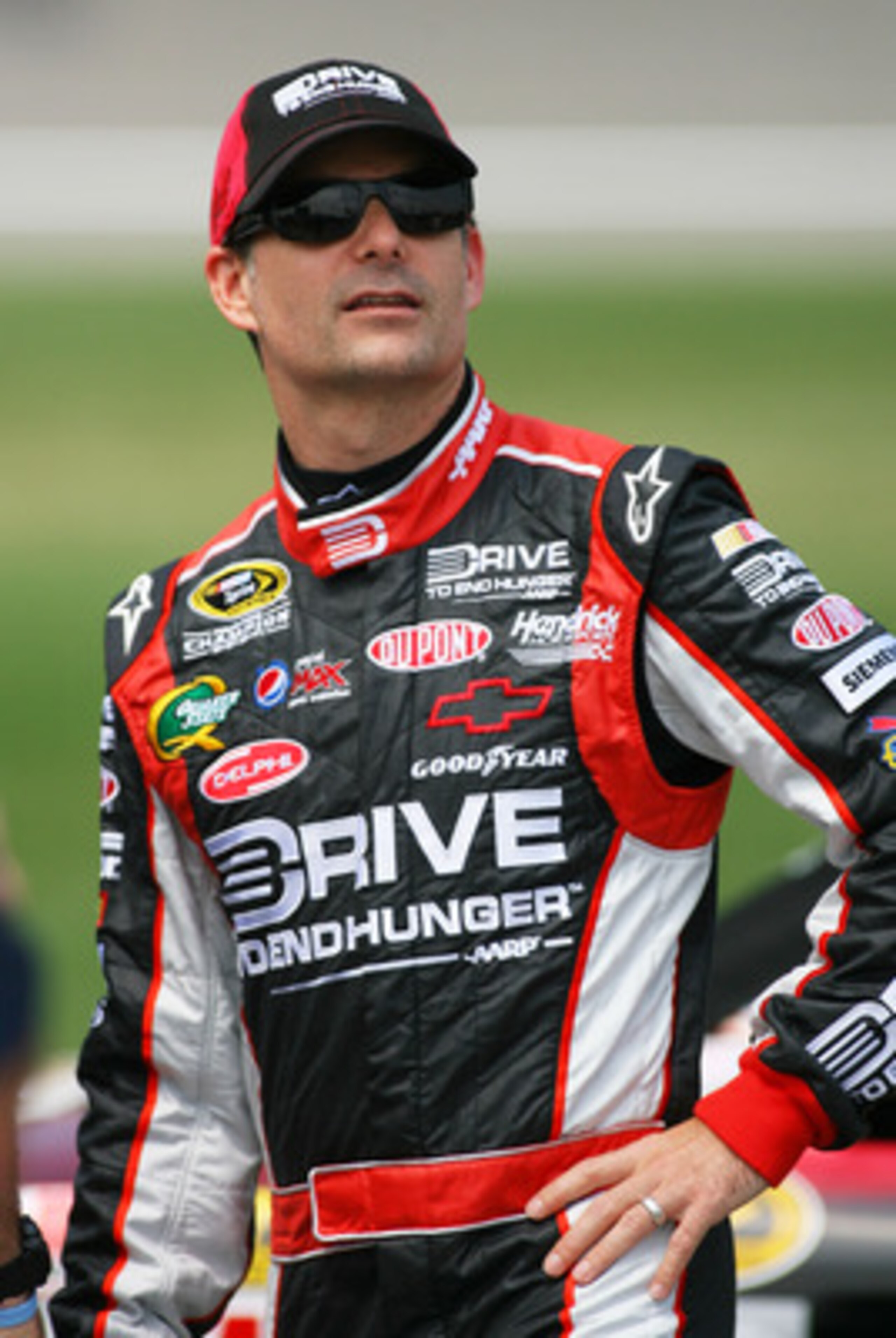 KANSAS CITY, KS - JUNE 04:  Jeff Gordon, driver of the #24 Drive to End Hunger Chevrolet, stands on the grid during qualifying for the NASCAR Sprint Cup Series STP 400 at Kansas Speedway on June 4, 2011 in Kansas City, Kansas.  (Photo by Tim Umphrey/Getty